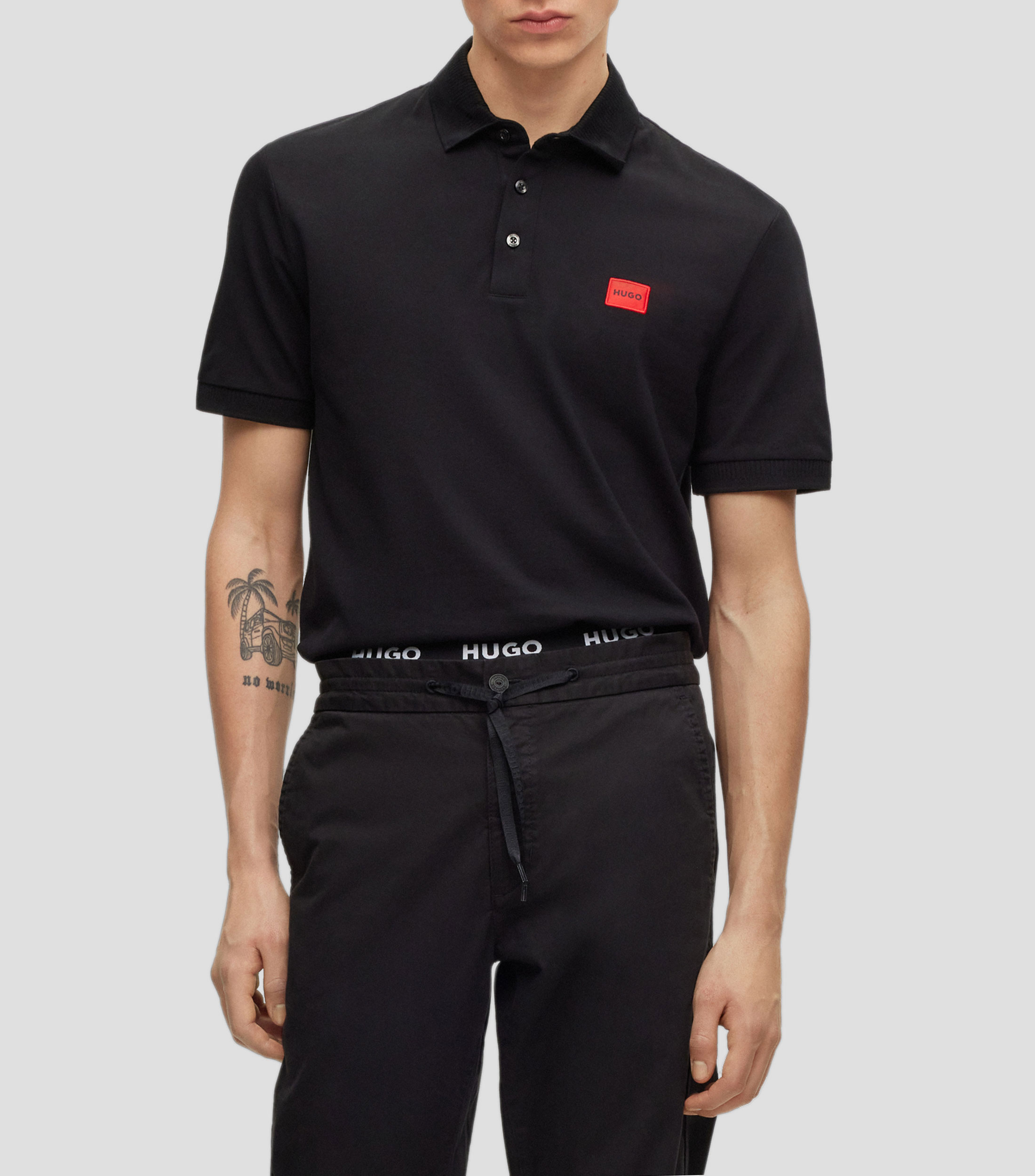 Polo slim fit Hugo de pique de algodon con etiqueta con logo roja Hombre