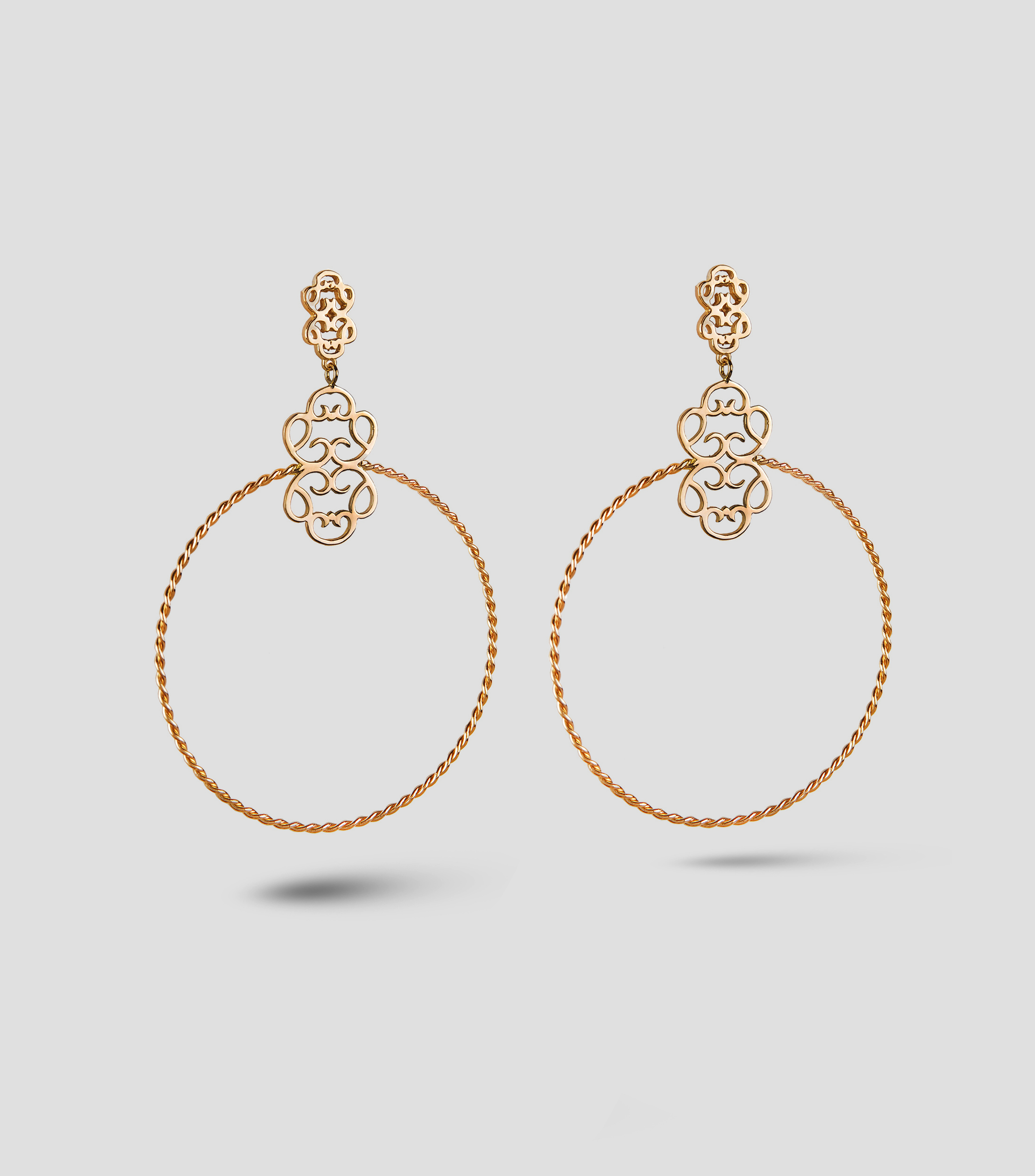 Aretes en plata Símbolo Real Mujer