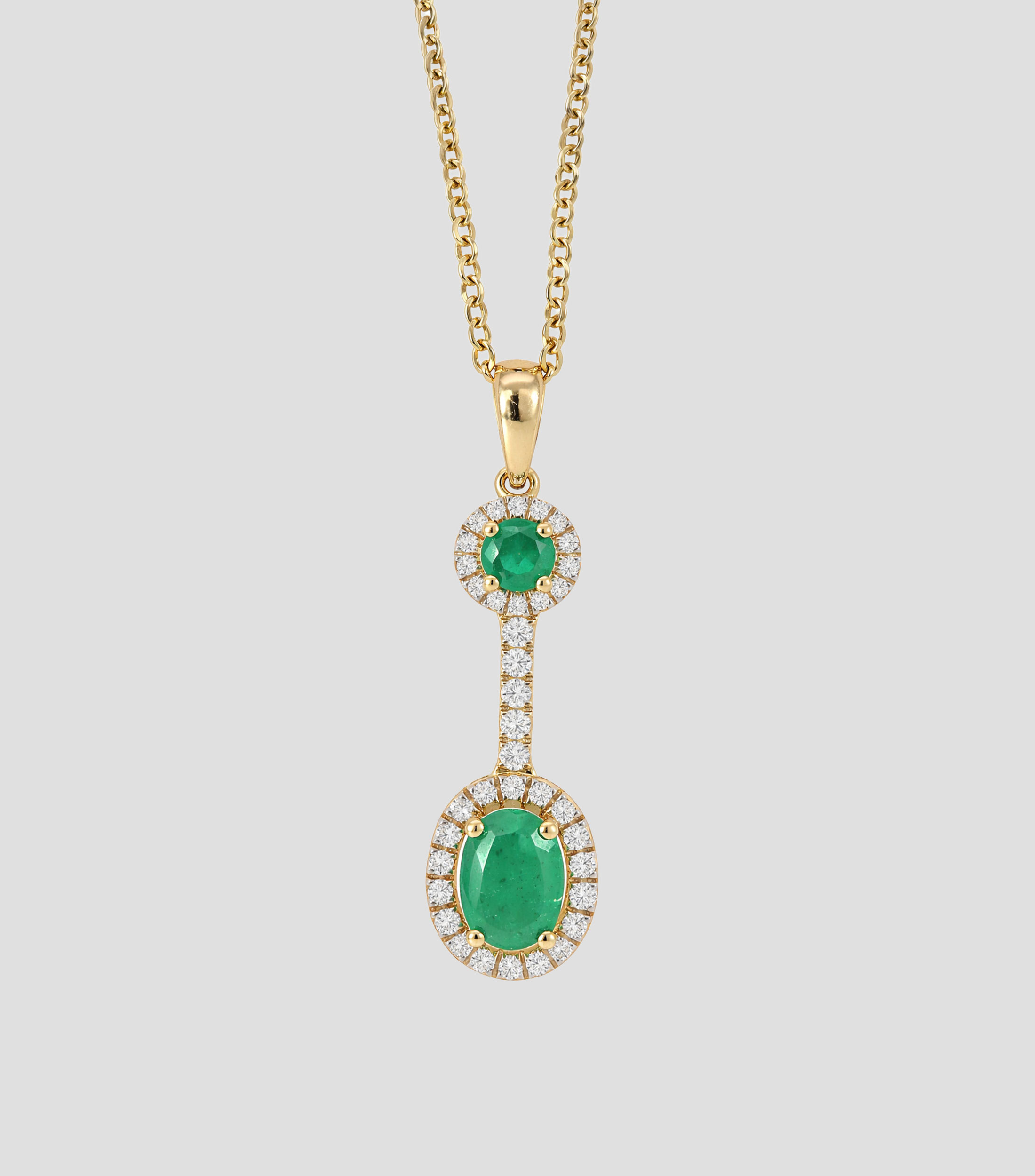 Dije con cadena en Oro de 14 Kilates con brillante y esmeralda Mujer