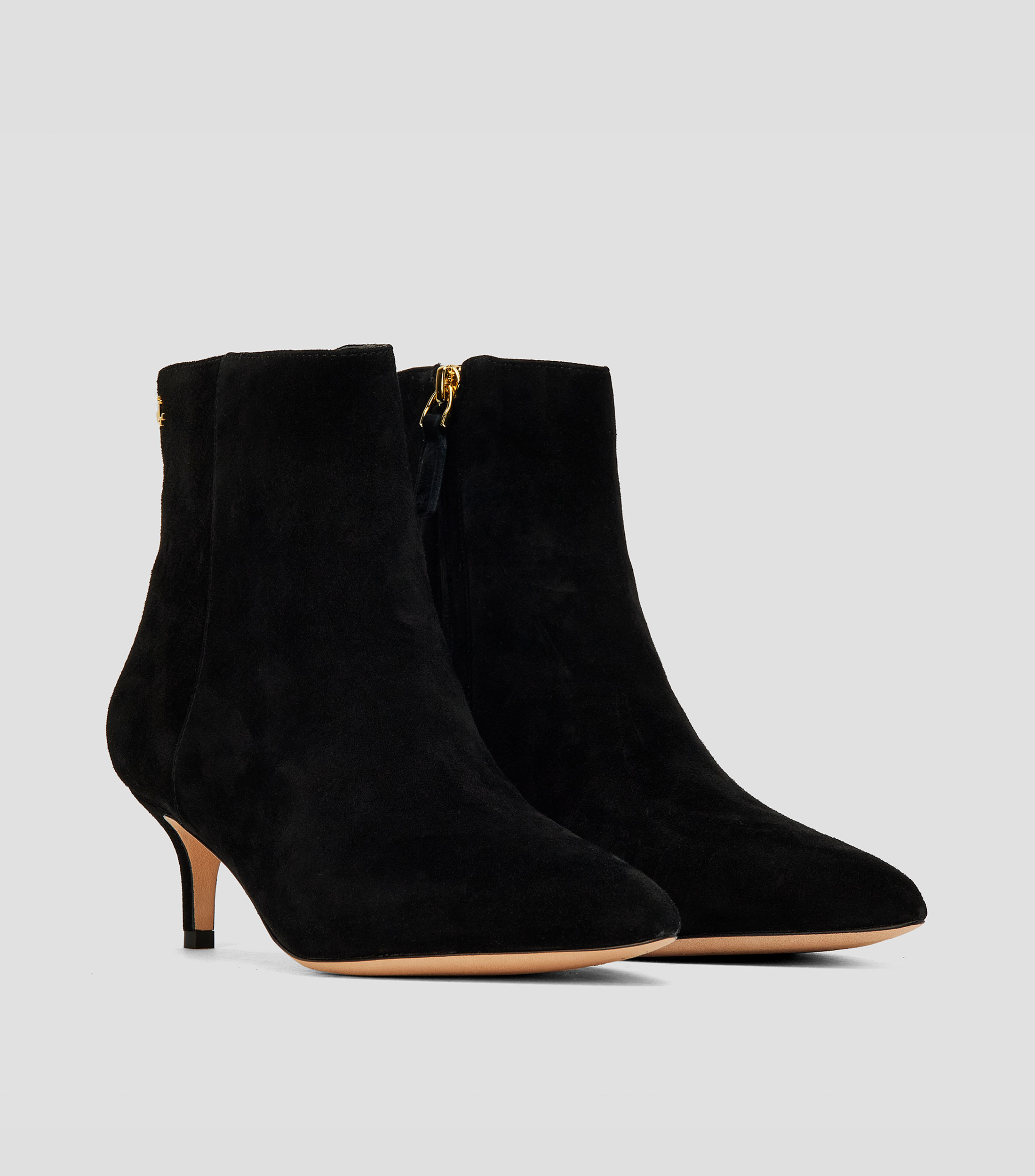 Botines casuales en piel con tacón bajo aguja Mujer