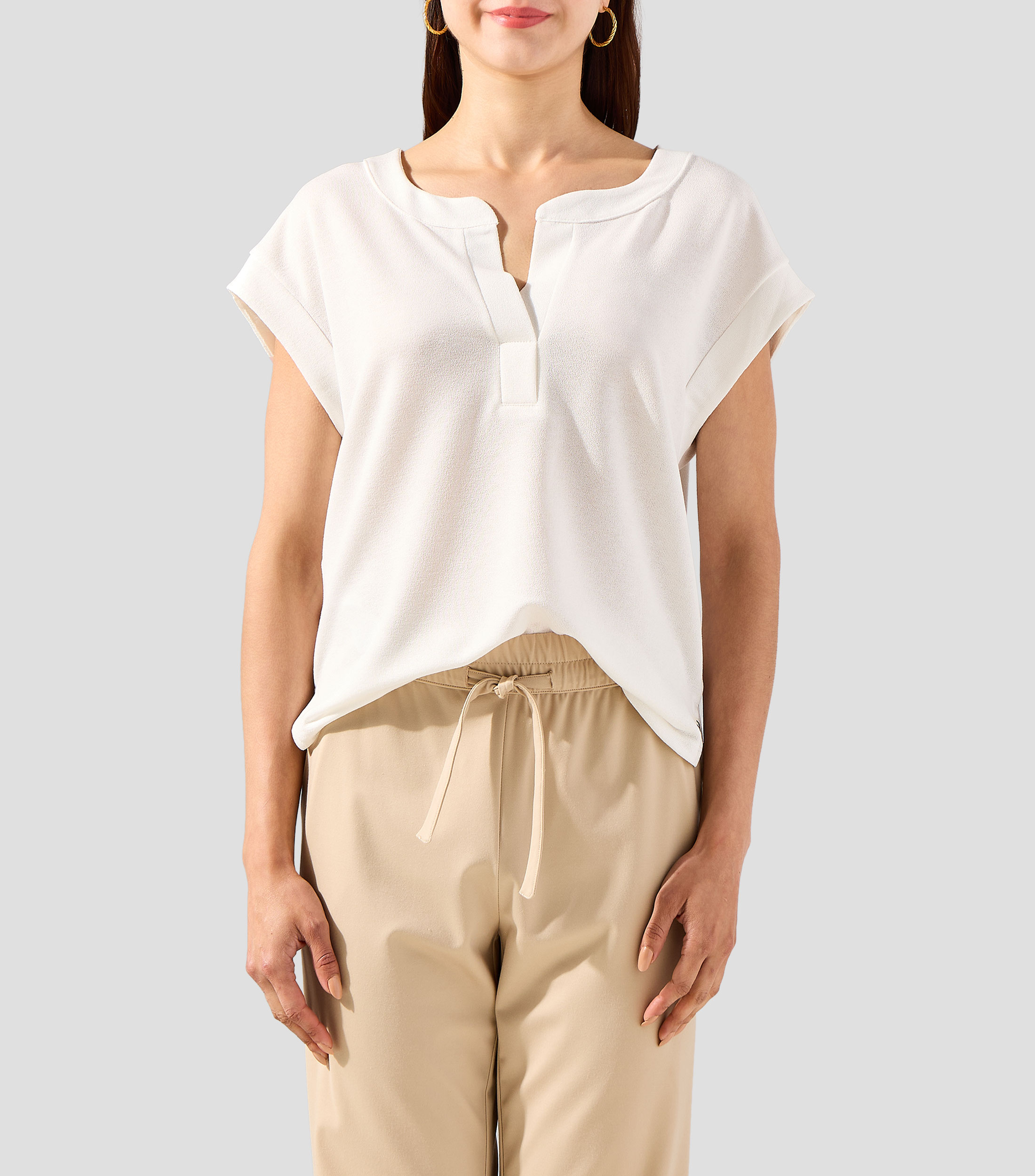 Blusa lisa sin mangas Mujer