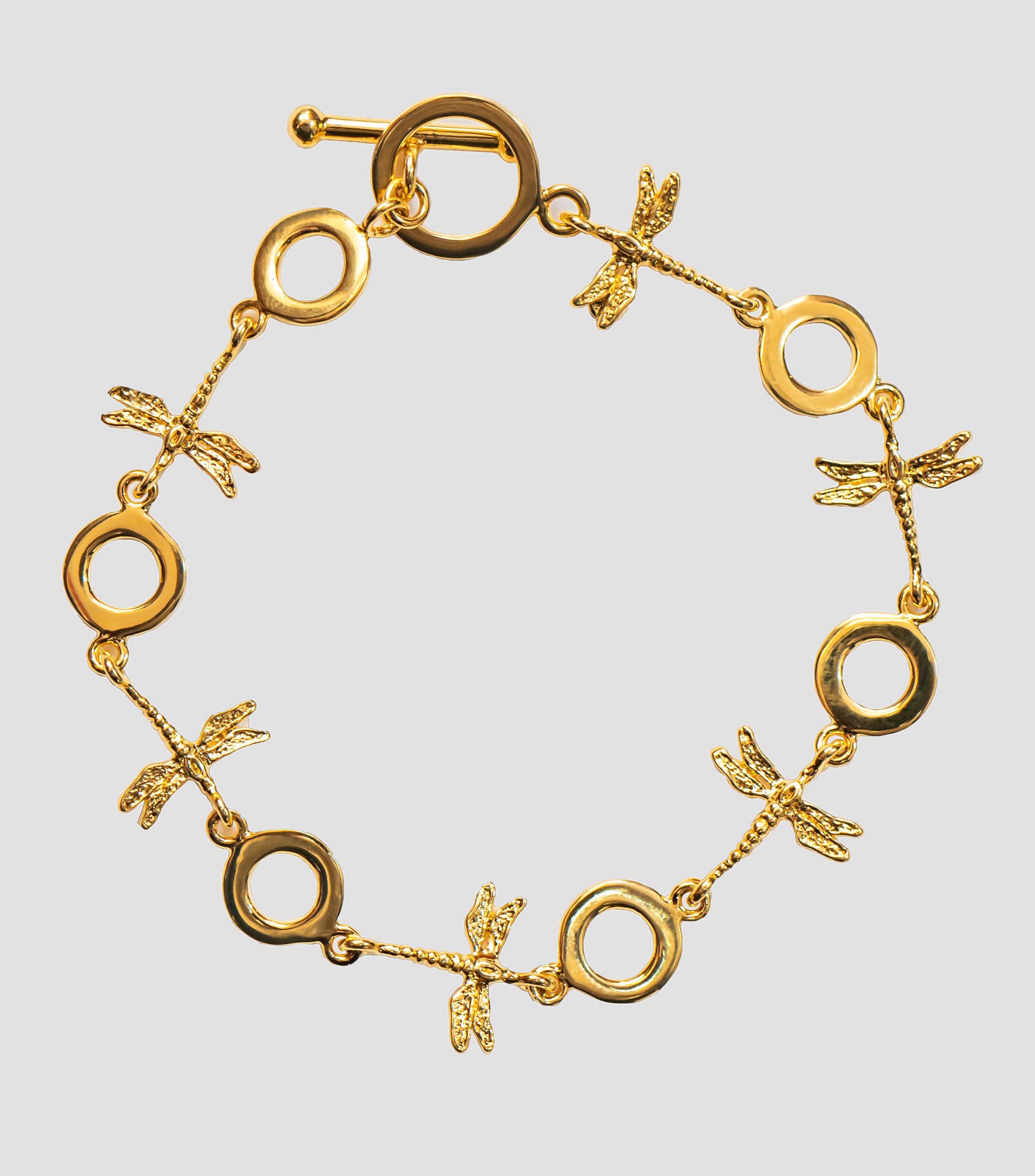 Brazalete con dijes de libélula y aros Mujer