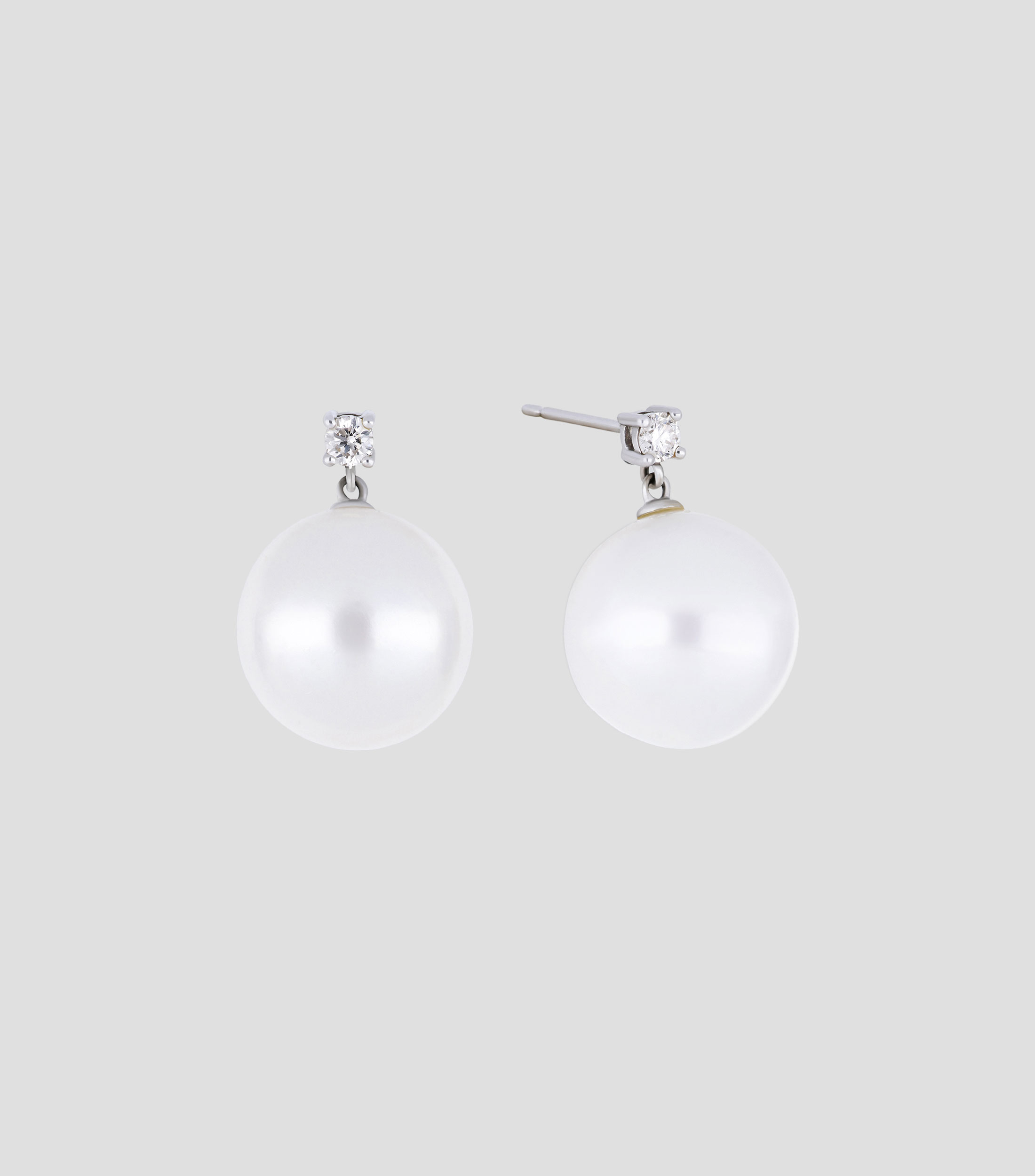 Broqueles en oro blanco 14 Kts con perla y diamante Mujer