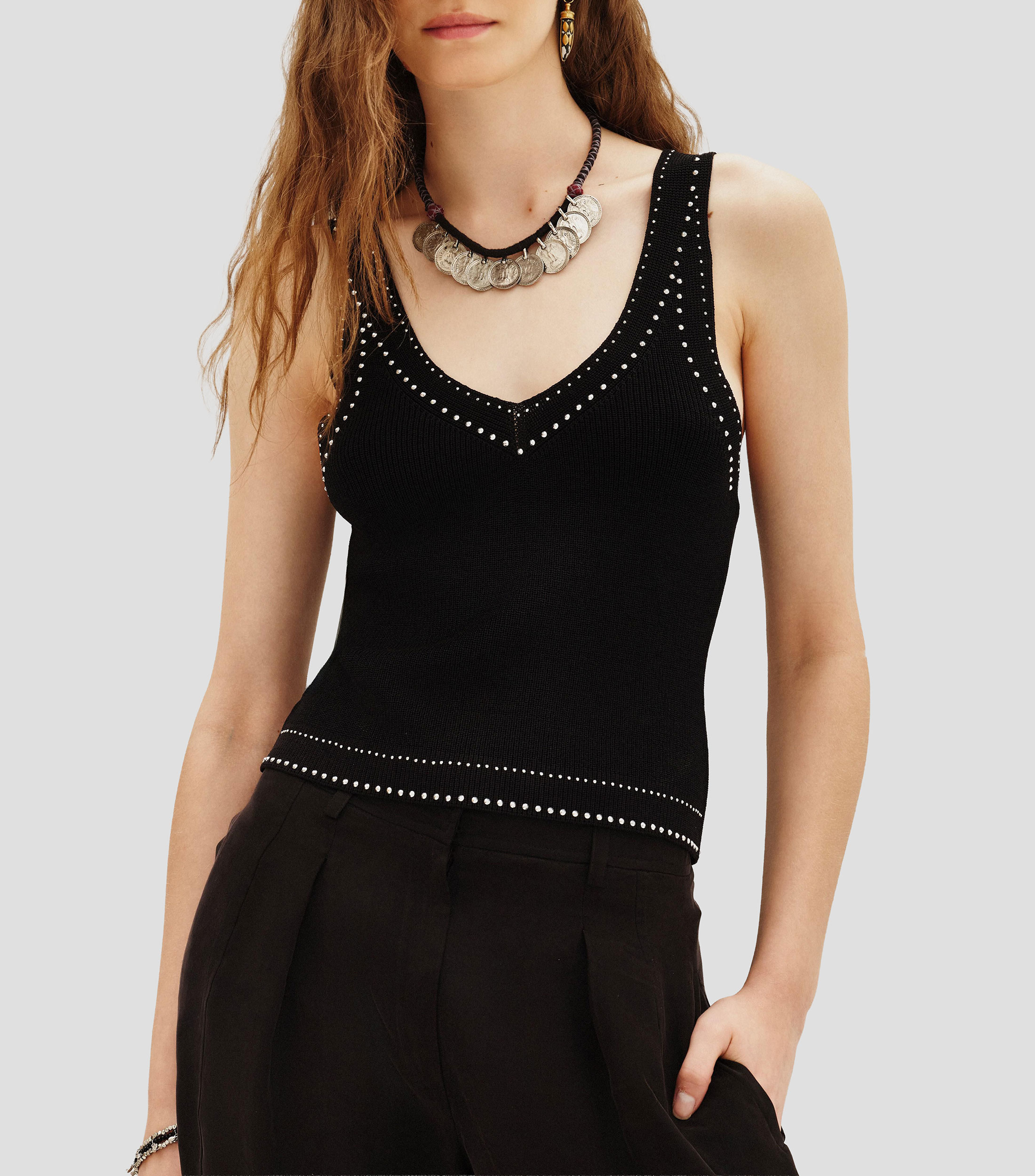 Blusa lisa sin mangas Mujer