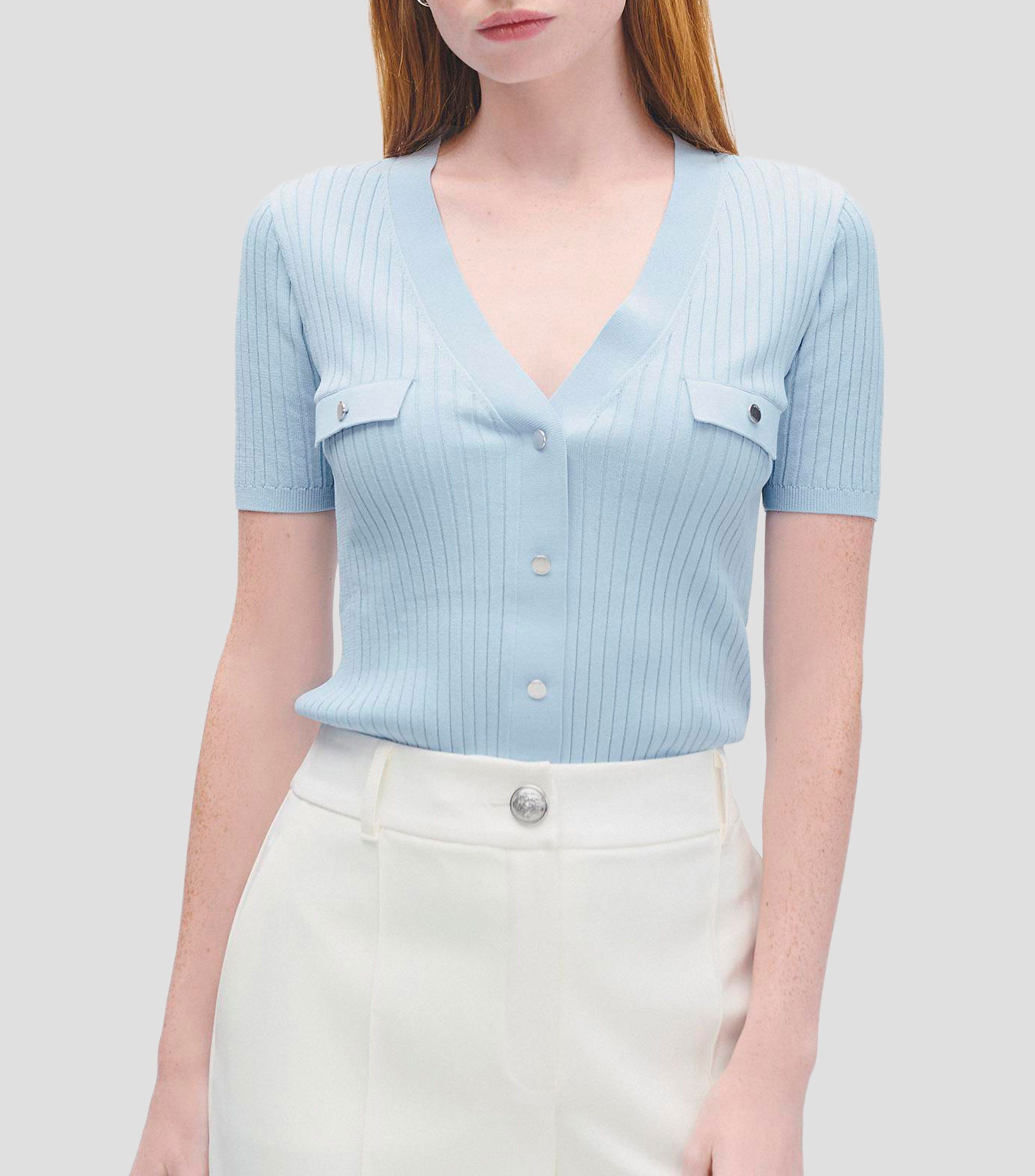 Blusa tejido canalé escote V aletilla y bolsillos simulados Mujer
