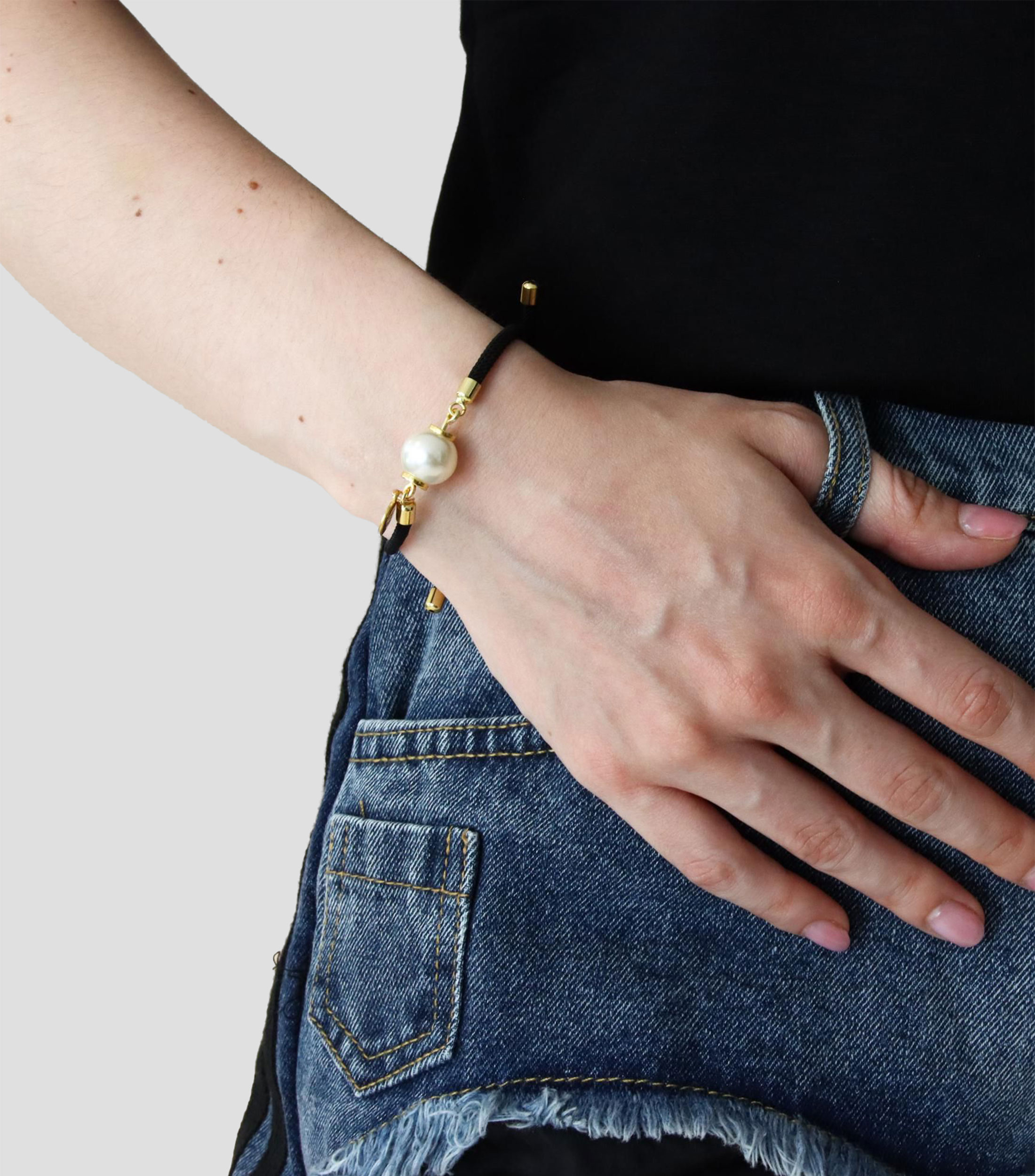 Pulsera negra con perla Mujer