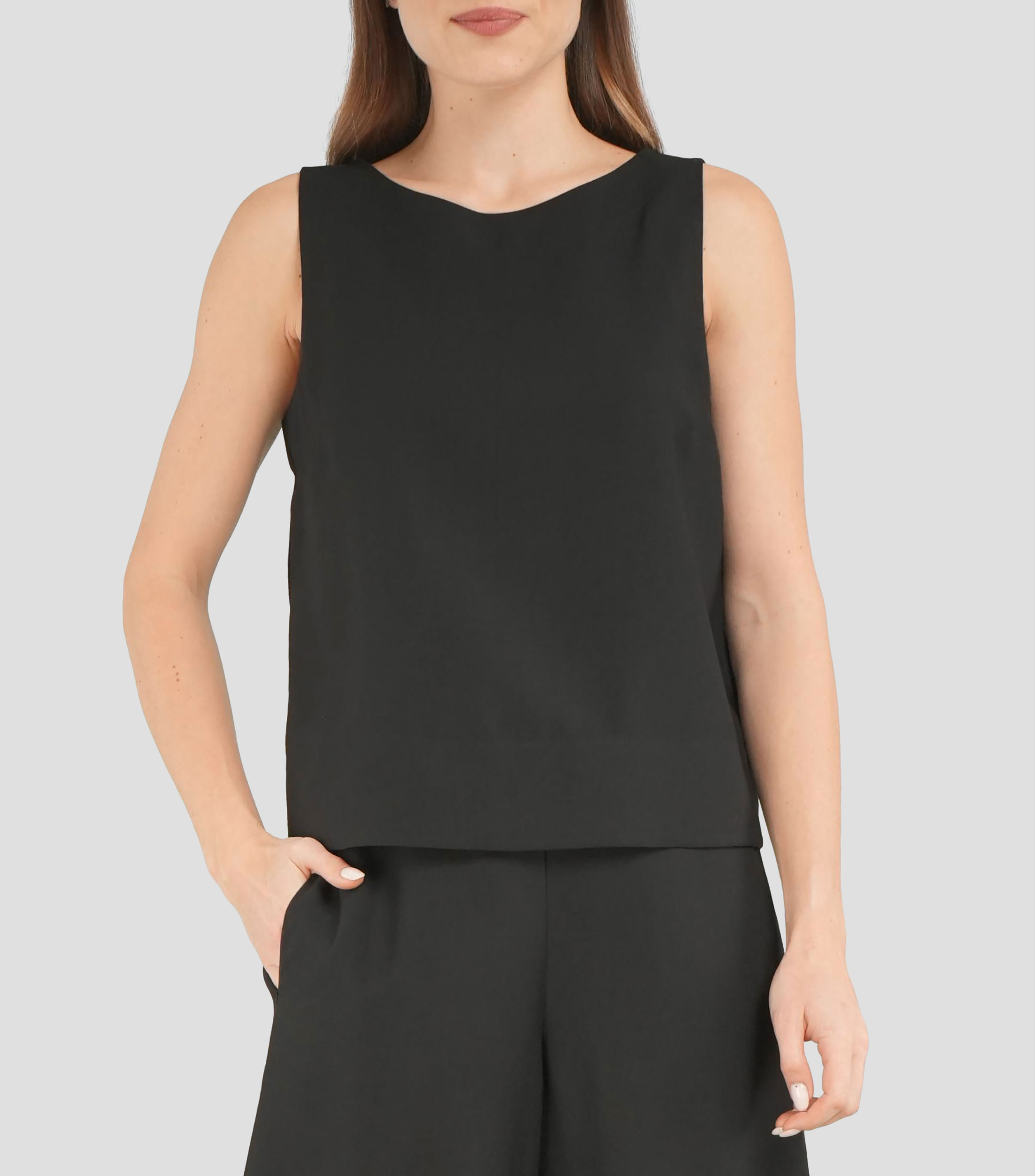 Blusa lisa sin mangas Mujer