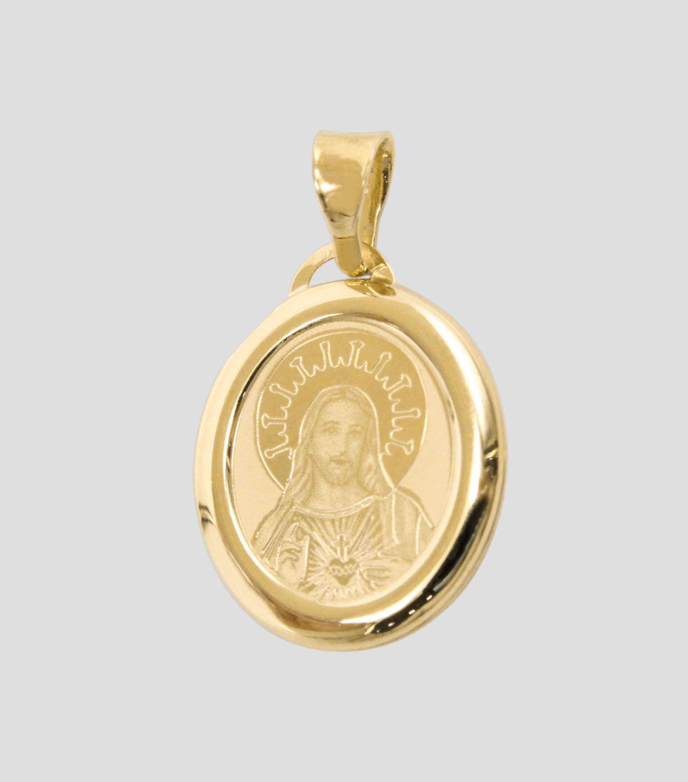 Medalla en oro amarillo 14 Kilates Sagrado Corazón Unisex