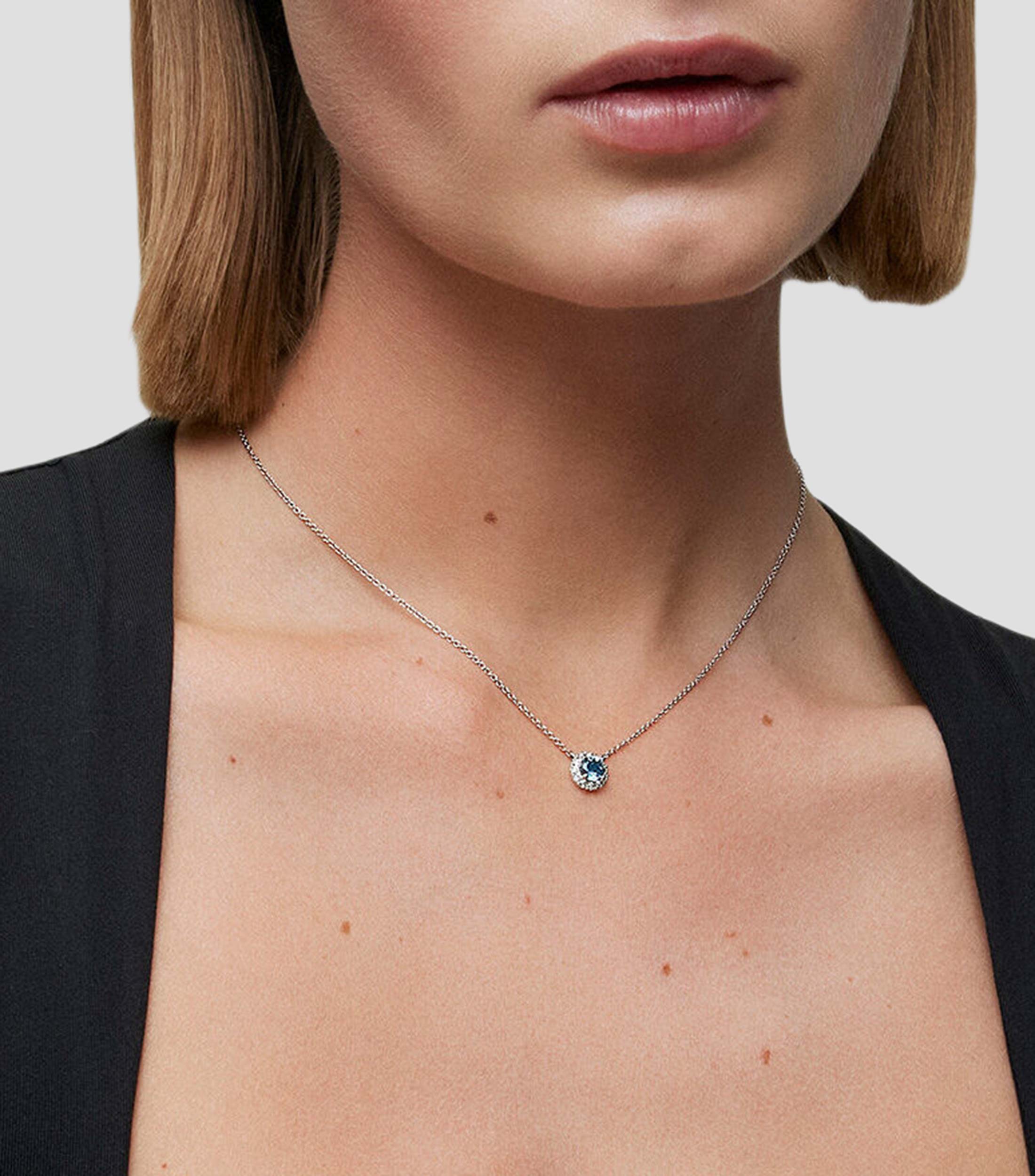 Colgante de oro blanco de 18K con topacio azul london de 0,57 cts y diamantes 0,13 cts