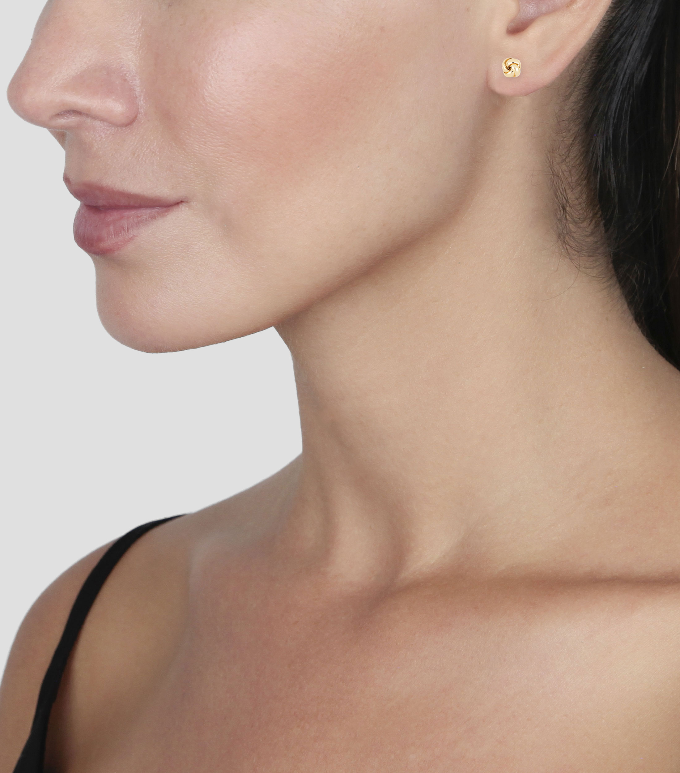 Aretes en oro amarillo 14 Kilates con nudo grande Mujer