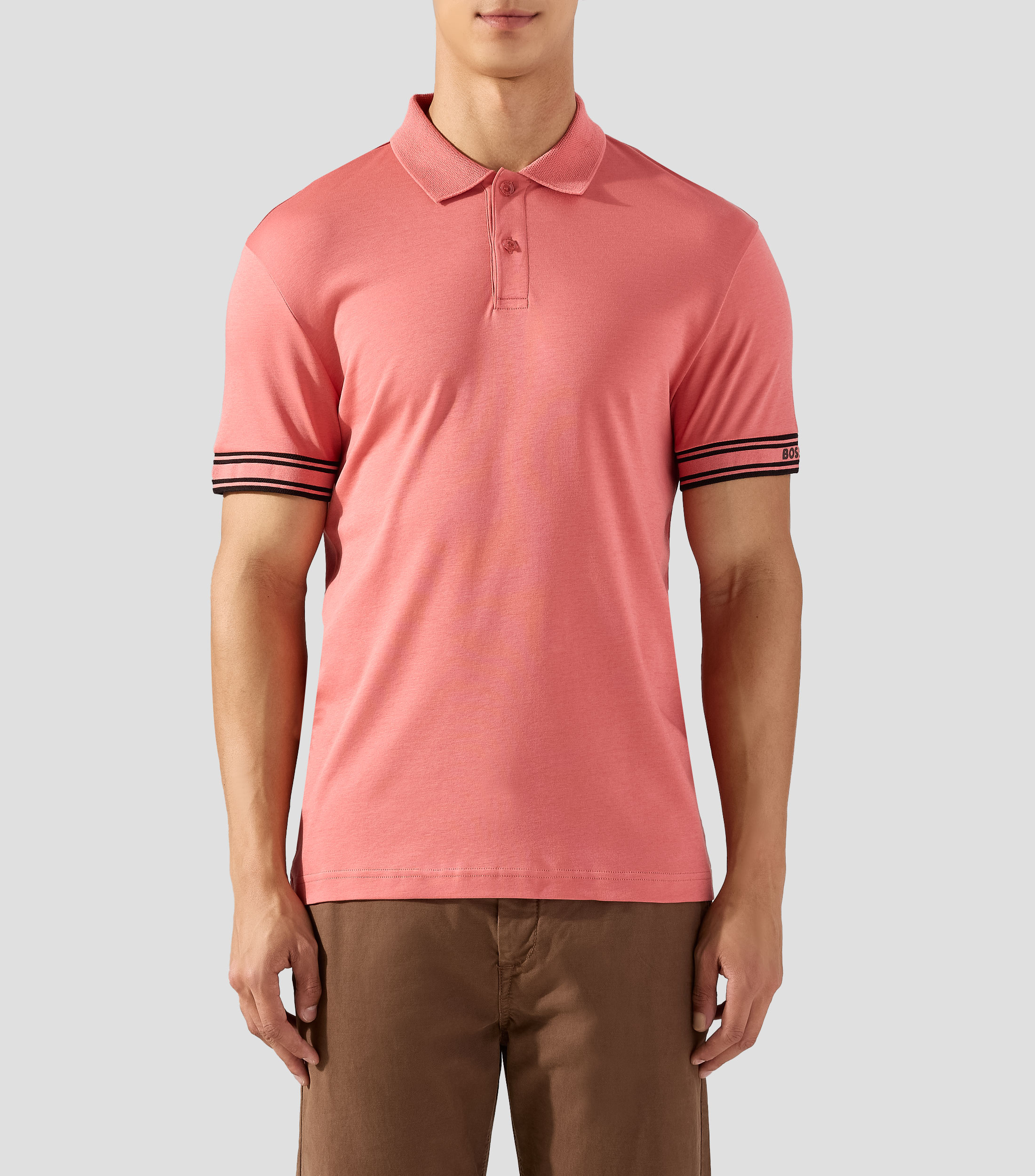 Playera tipo polo slim fit de algodón con puños a rayas Hombre