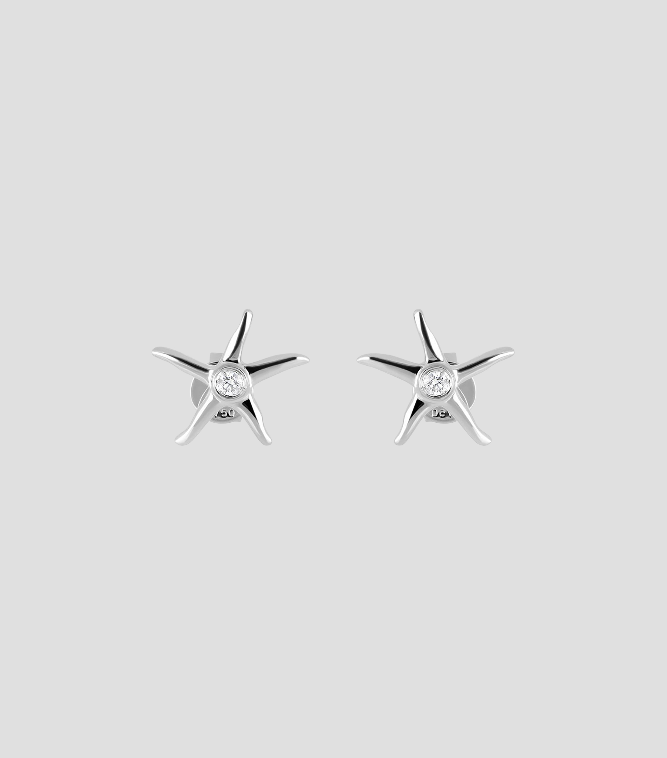 Broquele en Oro blanco de 18 Kilates en forma de estrella de mar con diamantes Mujer