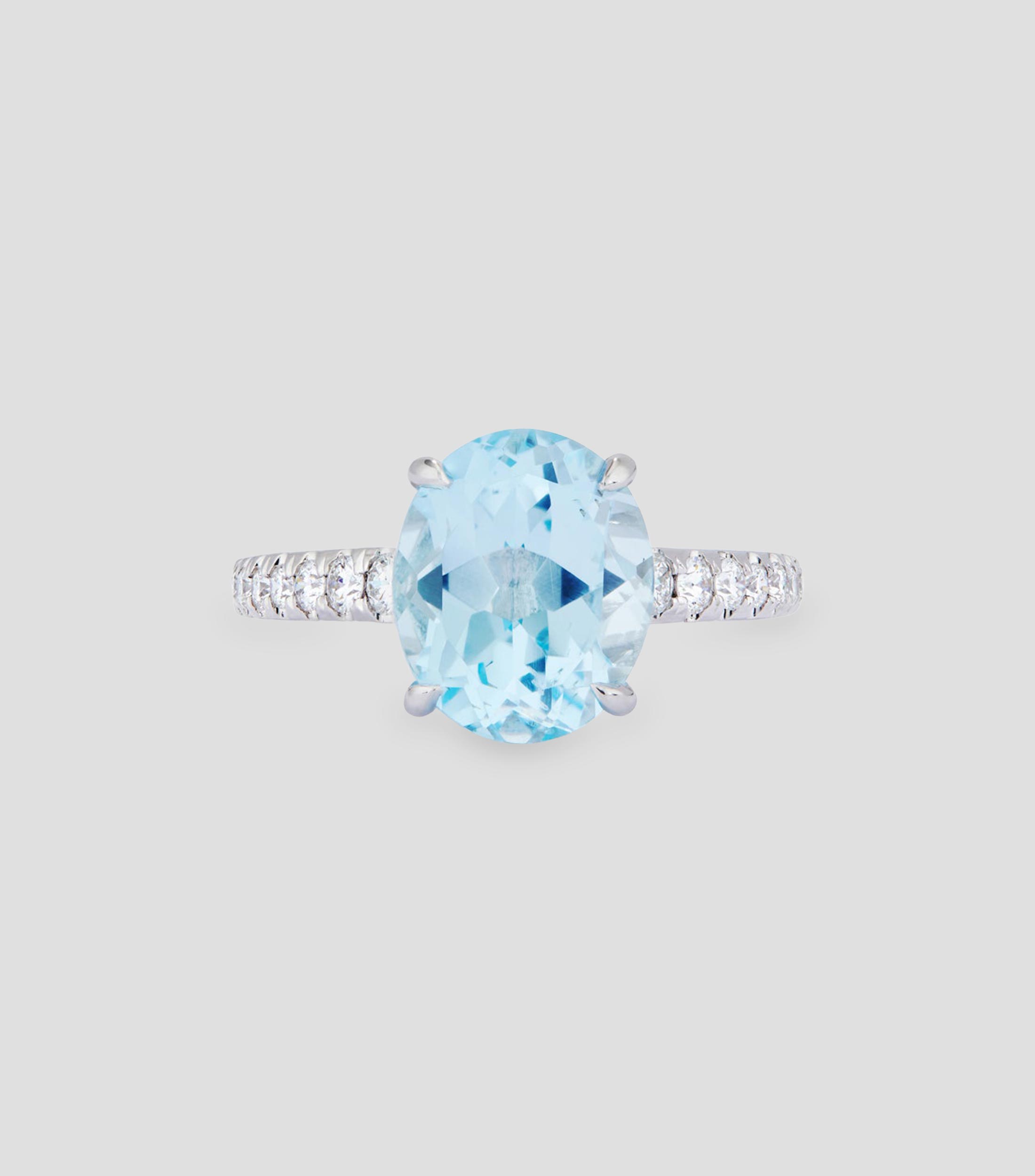 Anillo en Oro blanco de 18 Kilates con topacio y diamantes Mujer