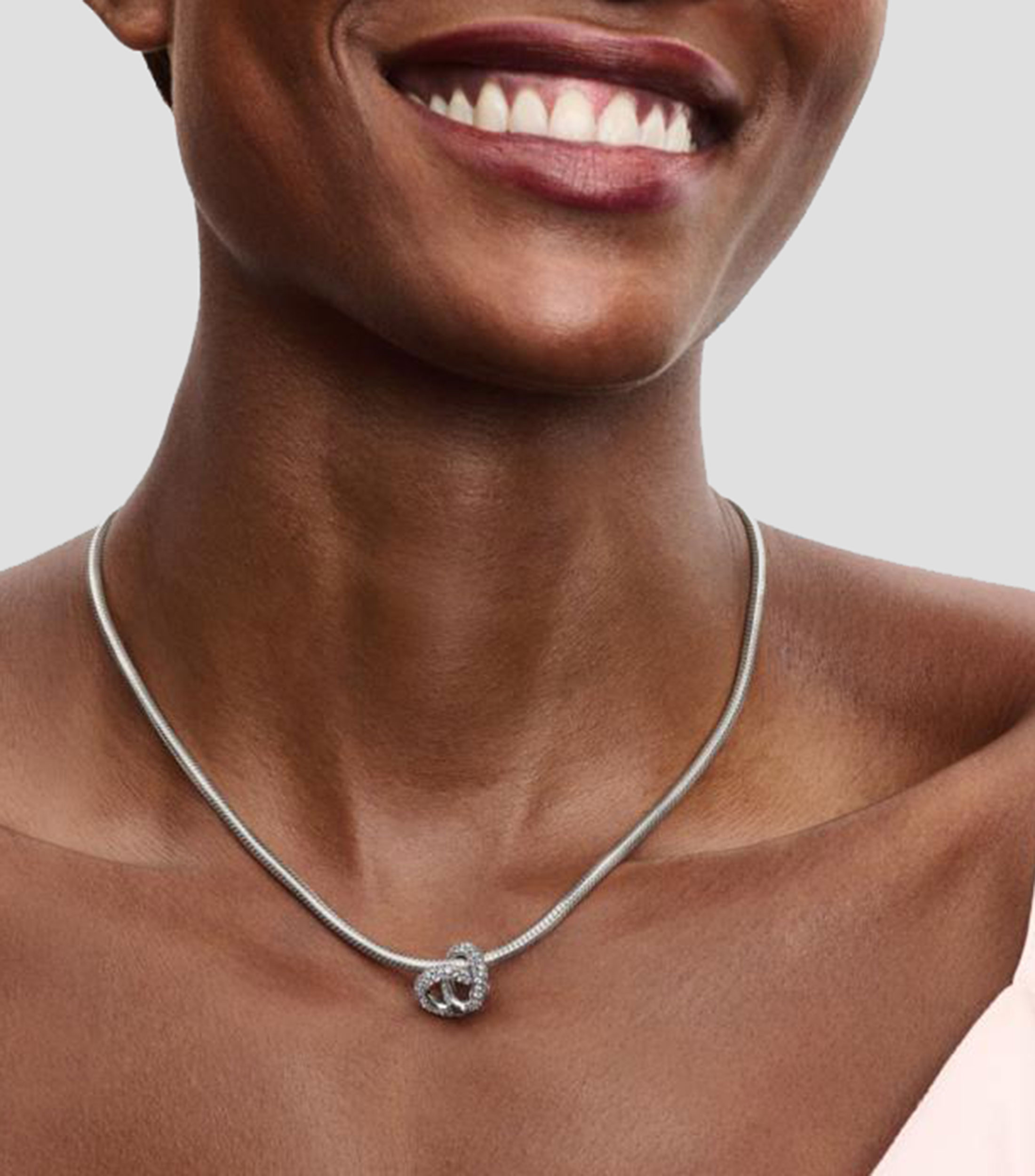 Charm Infinity Knot Heart en Plata .925 con Zirconias Unisex