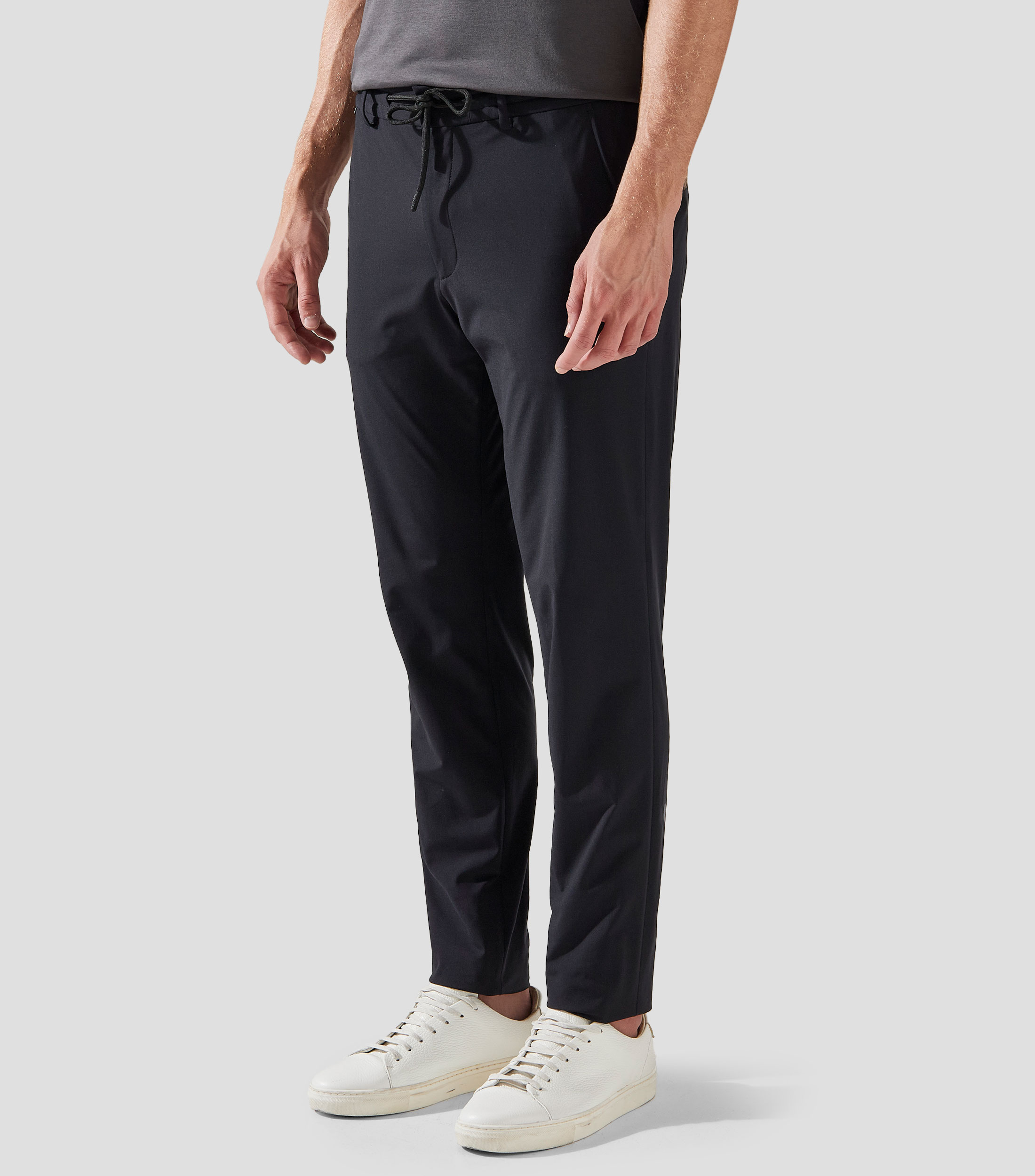 Pantalones slim fit de punto técnico elástico Hombre