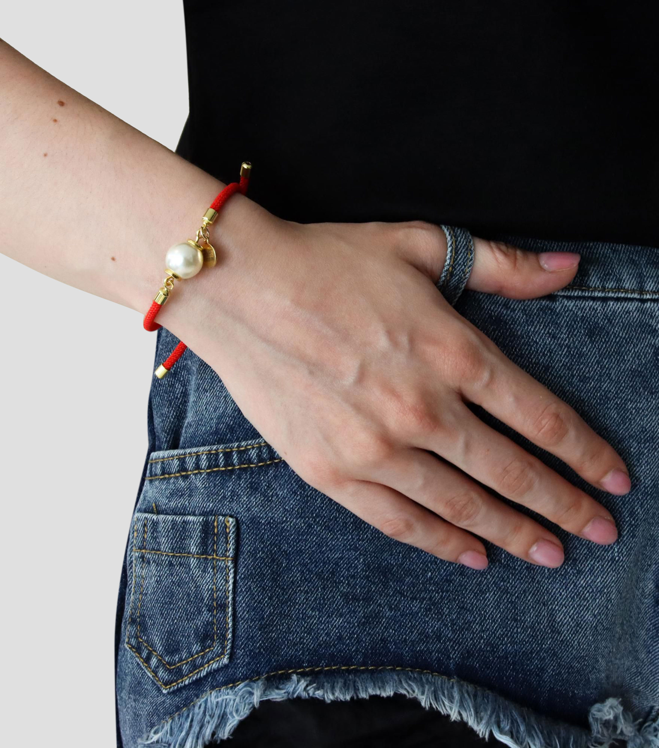 Pulsera roja con perla Mujer