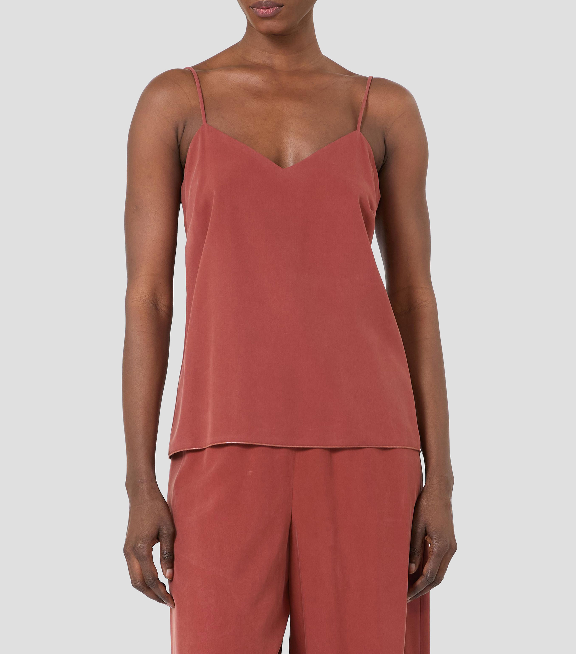 Blusa lisa sin mangas Mujer