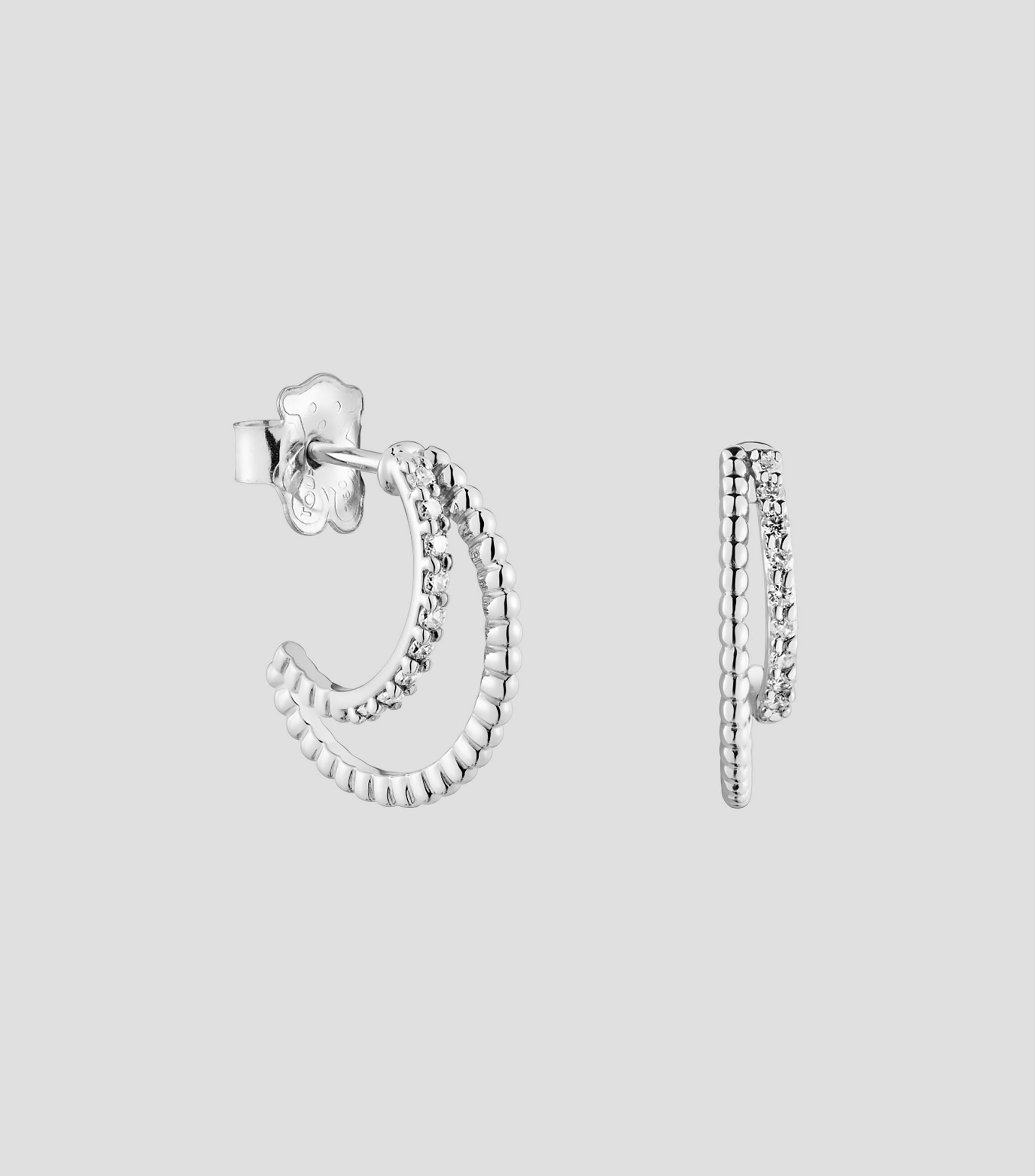 Aretes en oro blanco de 18 kilates en forma de medio aro con diamantes Mujer