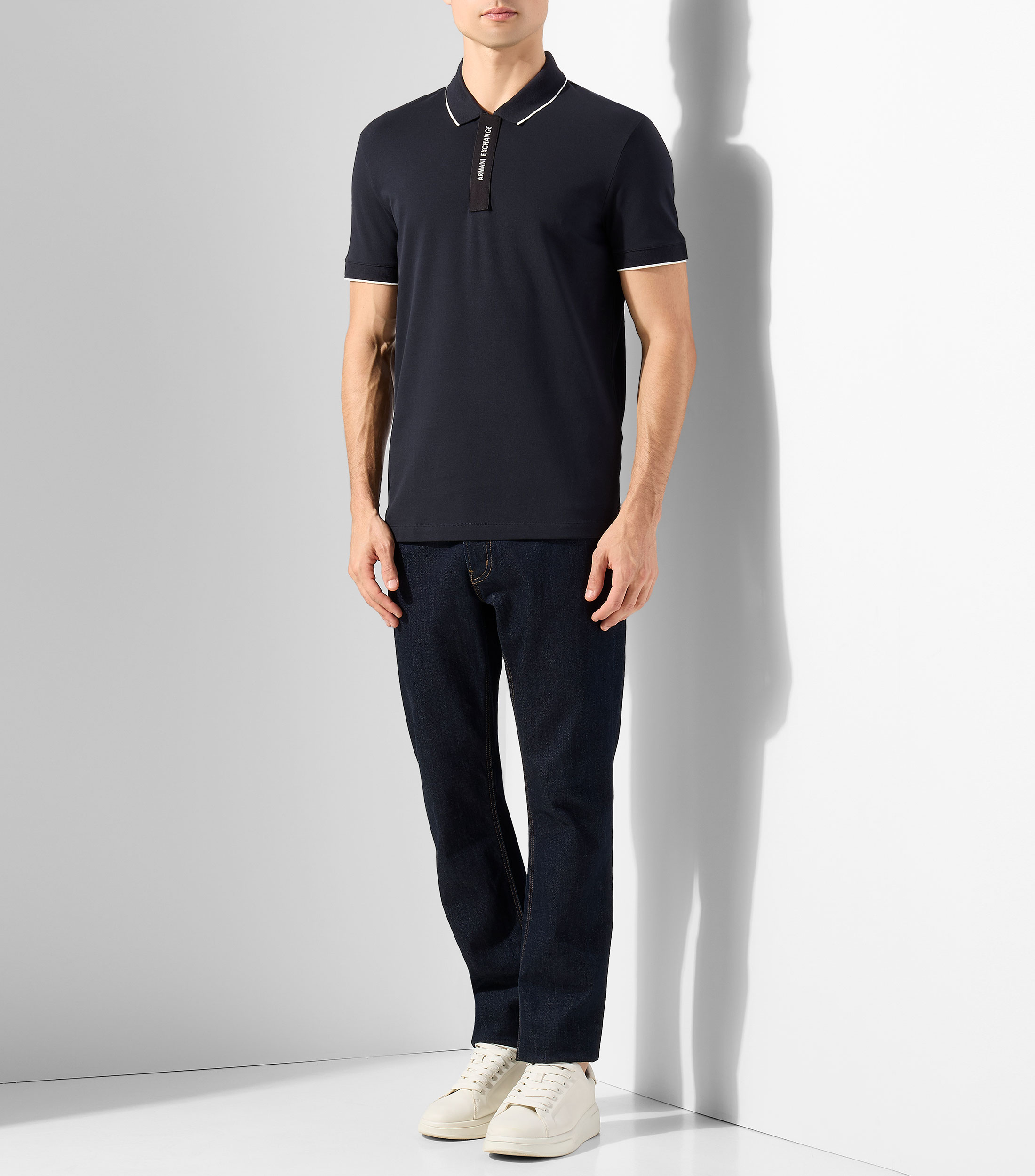 Playera tipo polo con manga corta lisa Hombre