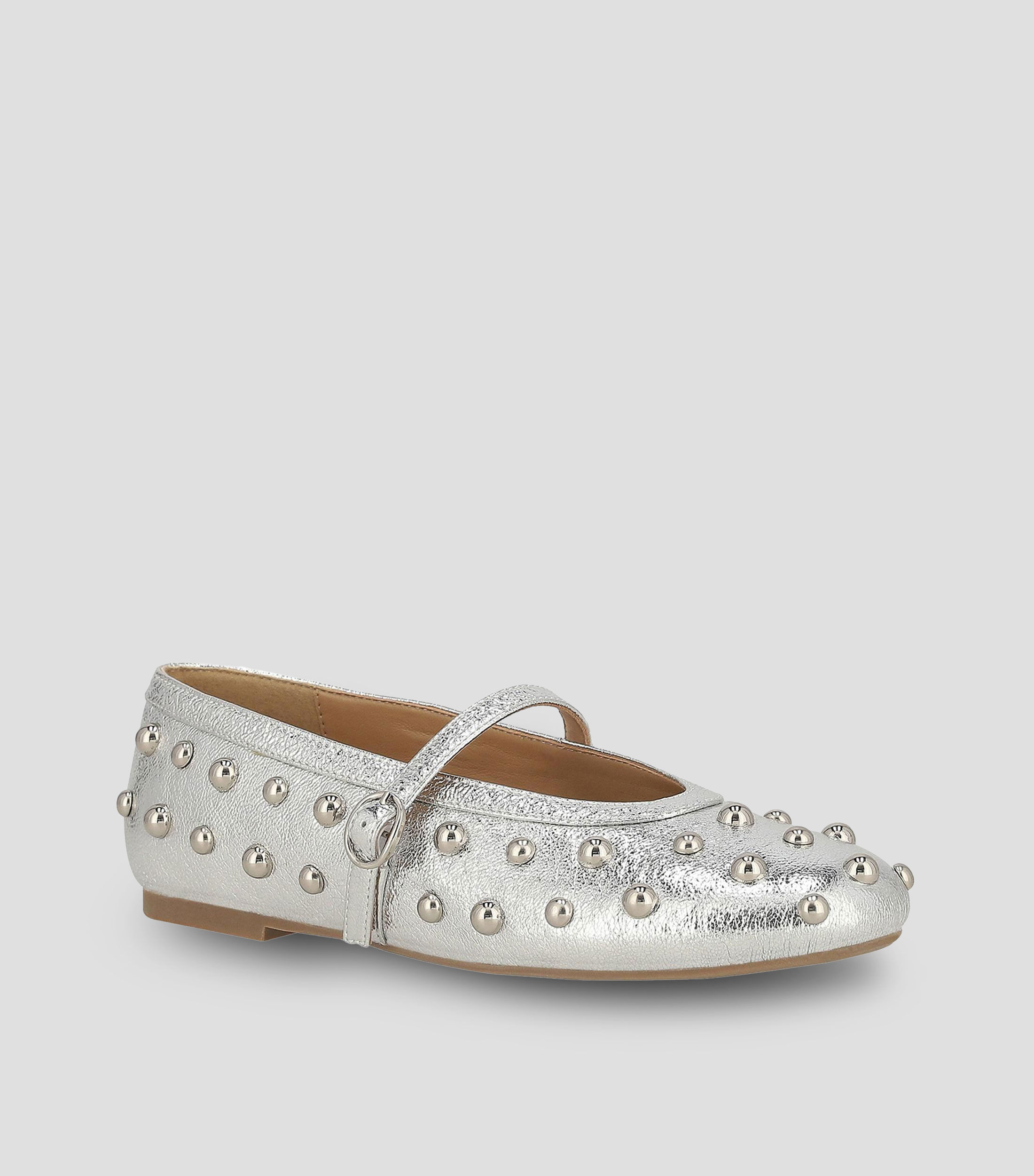 Flats en piel con tacón media luna y estoperol Mujer