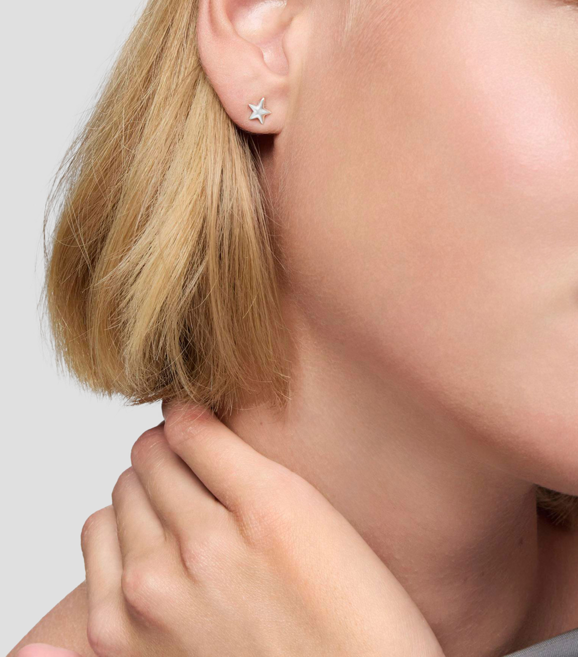 Aretes en plata motivo de estrella Mujer