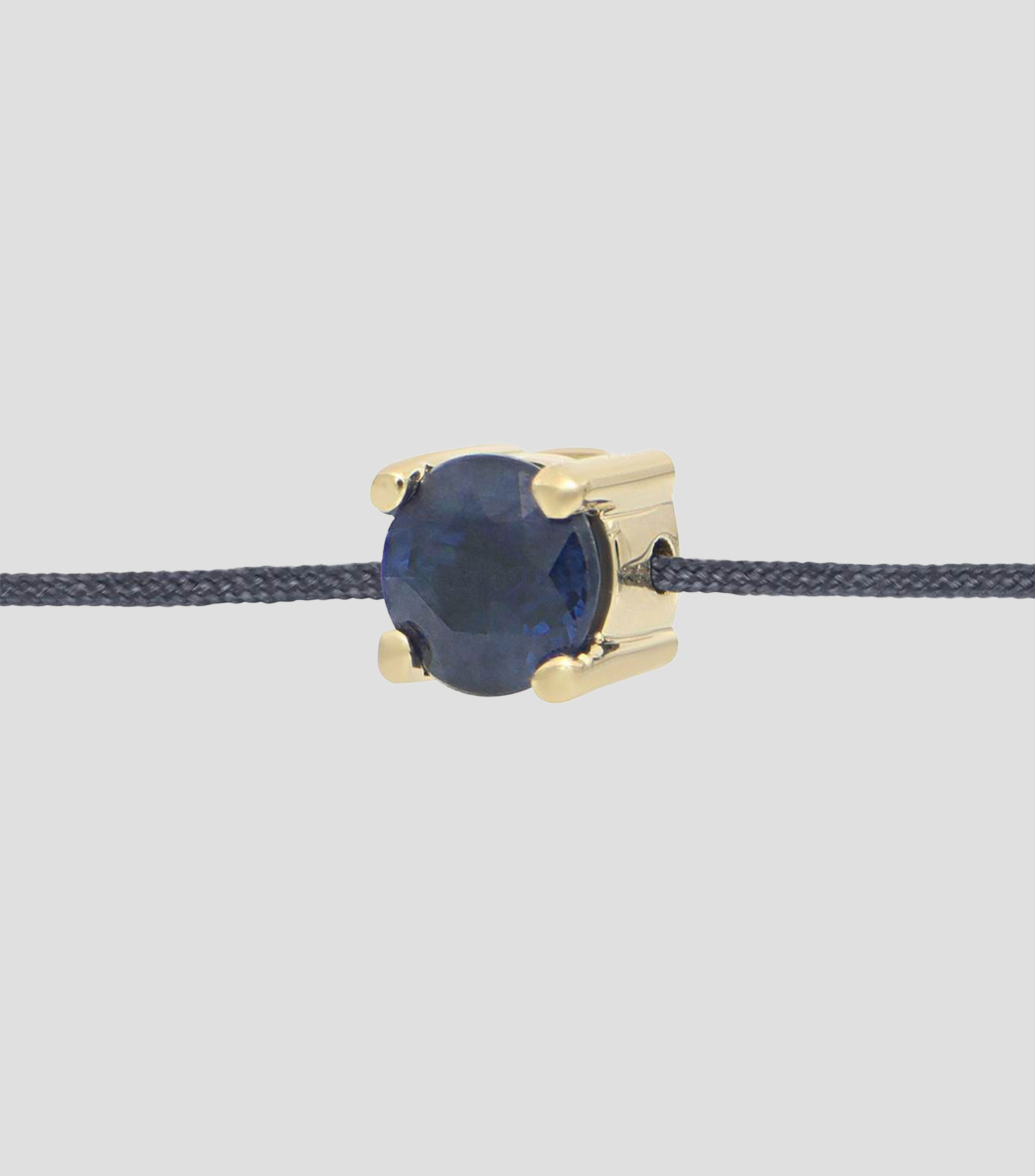 Pulsera en hilo gris con dije zafiro Mujer