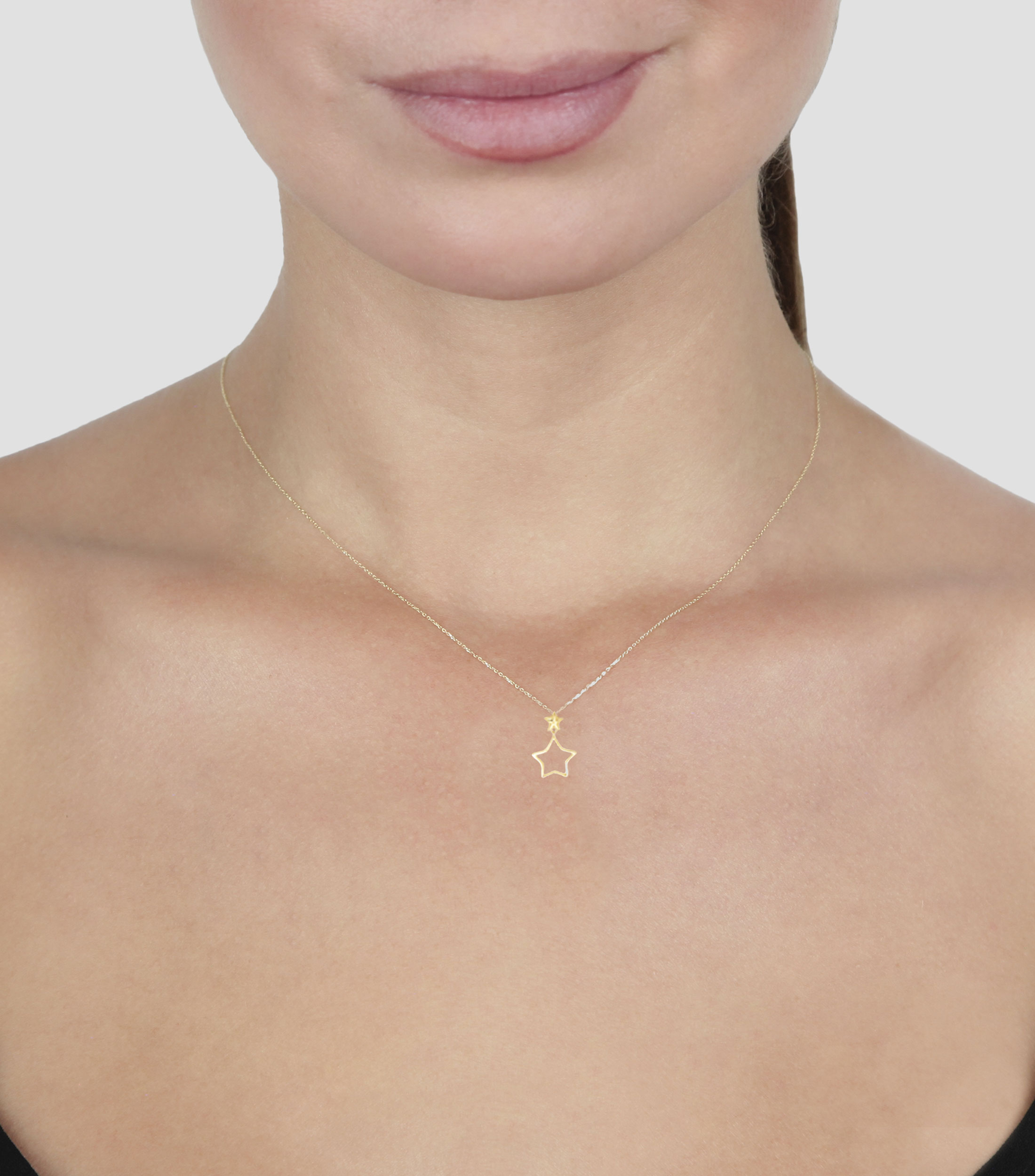 Collar en oro de 14 kilates con dije de estrella Mujer
