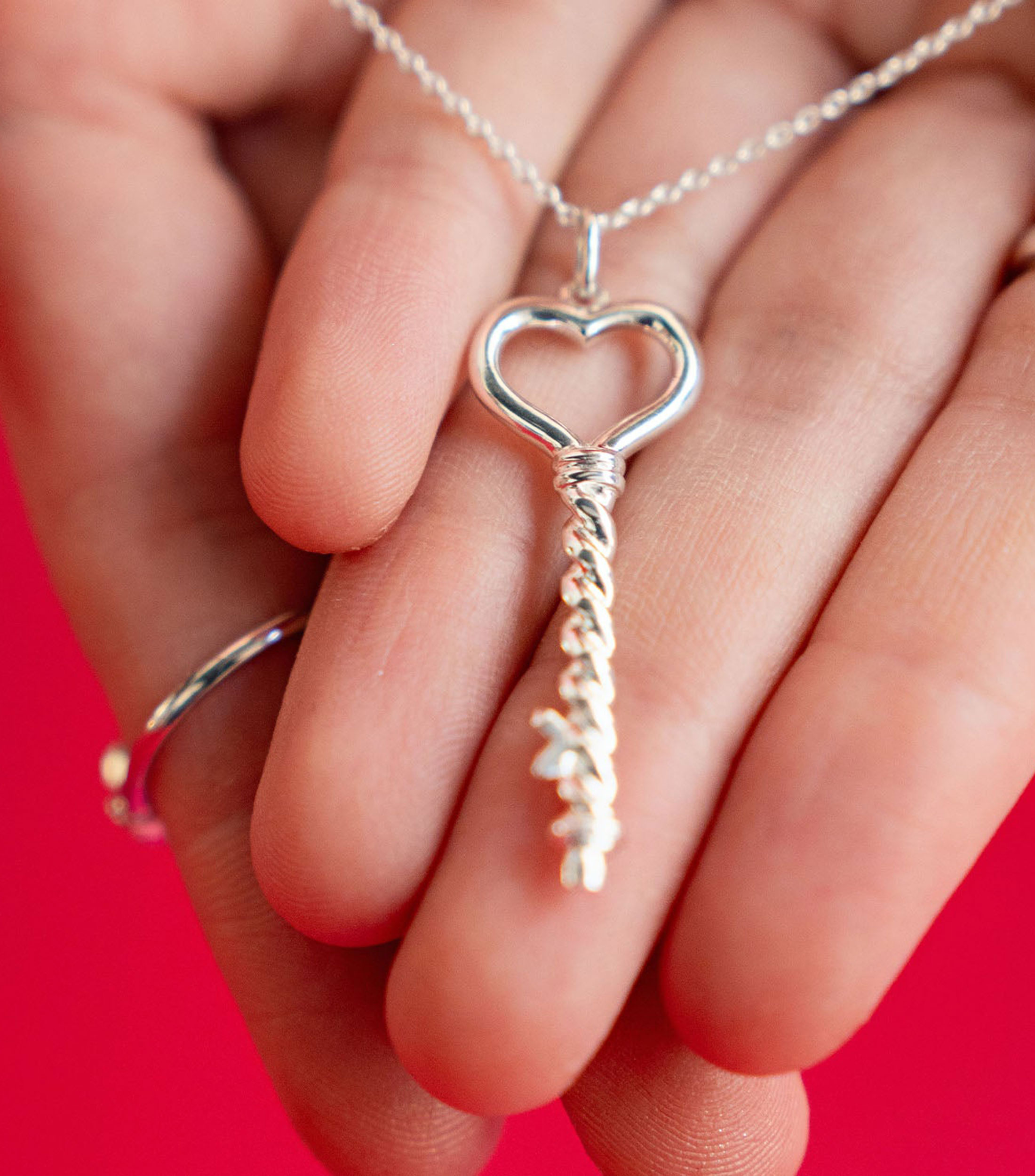 Dije Llave del corazon en plata .925 Mujer