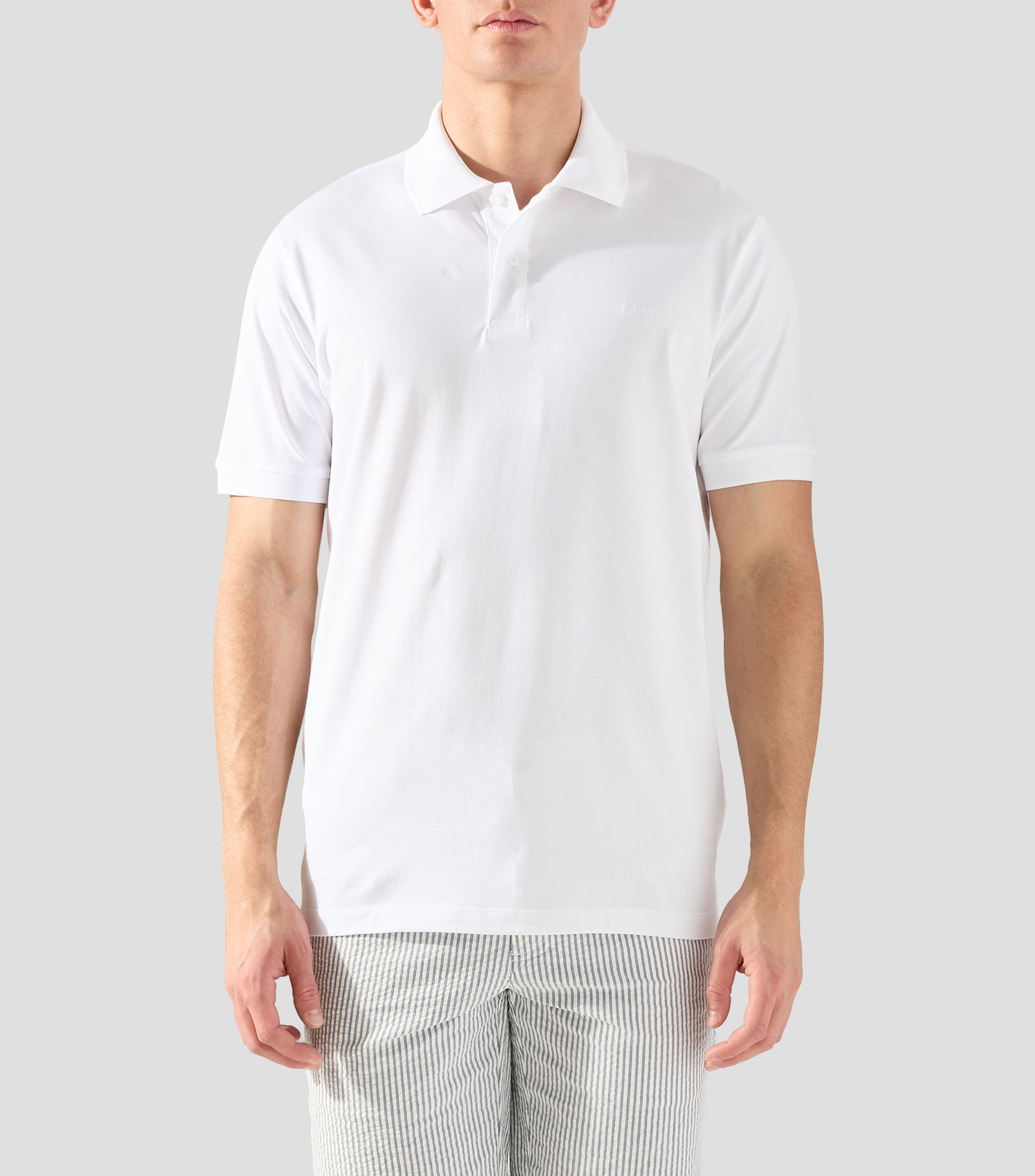 Playera tipo polo con manga corta lisa Hombre
