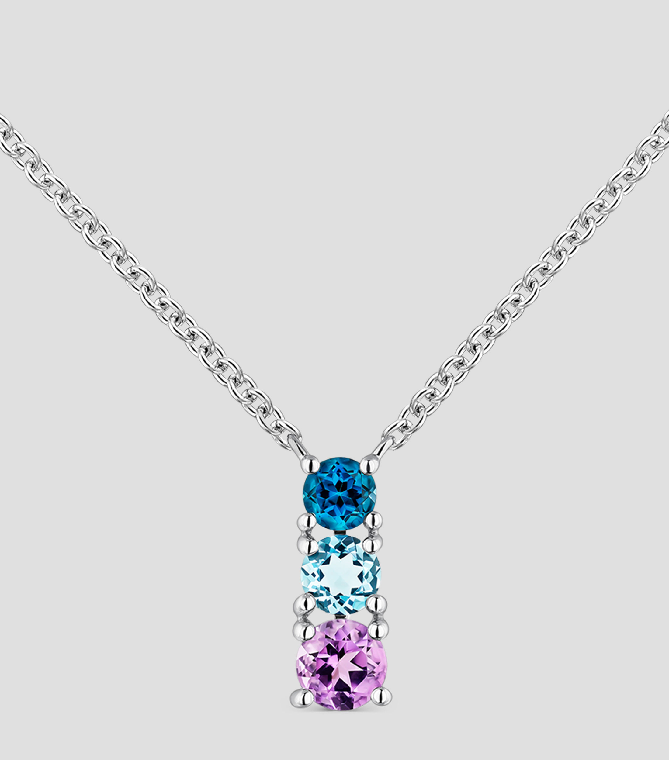 Colgante de plata 925 con topacio azul london, topacio azul swiss y amatista morada en talla brillante