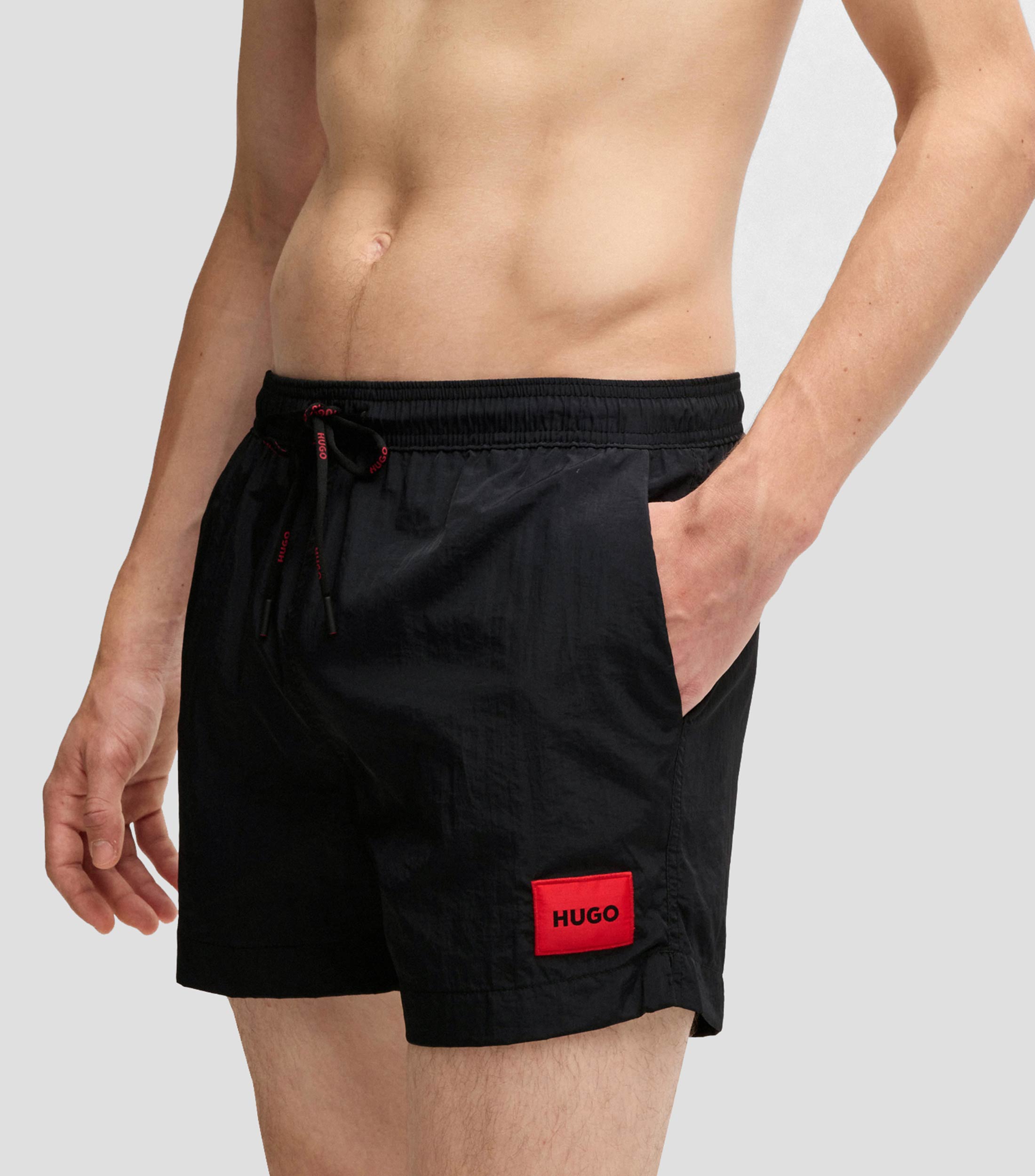 Traje de baño tipo short con forro integral y etiqueta de logo roja Hombre