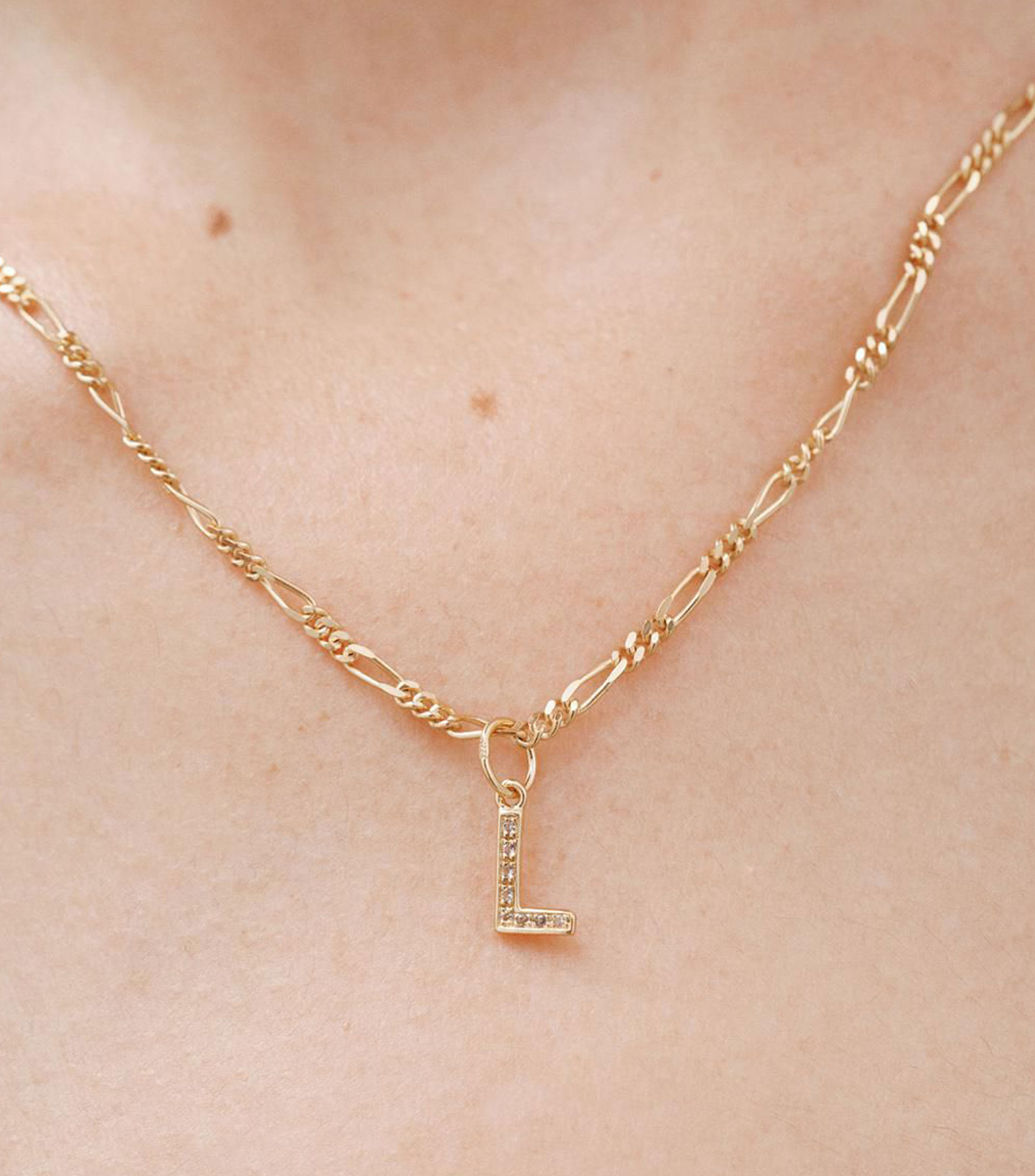 Charm letra "L" en plata .925 con topacio blanco Mujer