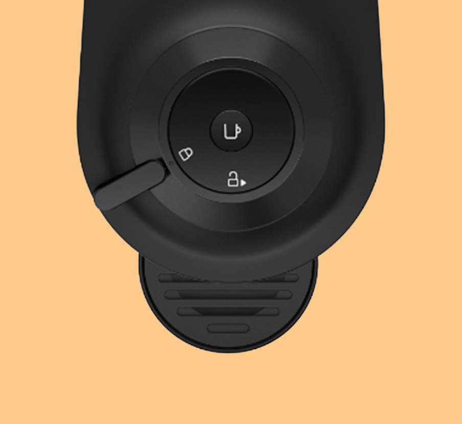 Imagen de una cafetera negra de la marca NESPRESSO