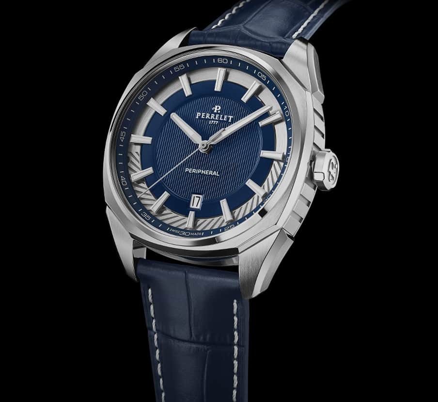 Imagen de un reloj plateado con azul. PERRELET