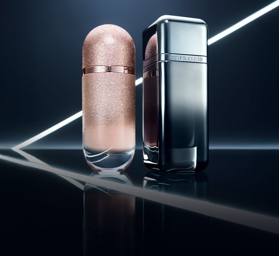 Imagen de dos lociones una rosa y una negra CAROLINA HERRERA