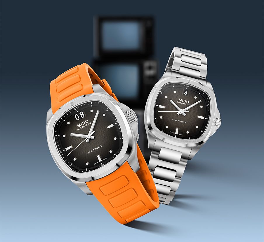 imagen de dos relojes plateados, uno con extensible anaranjado y el otro plateado con caratula negra, MIDO