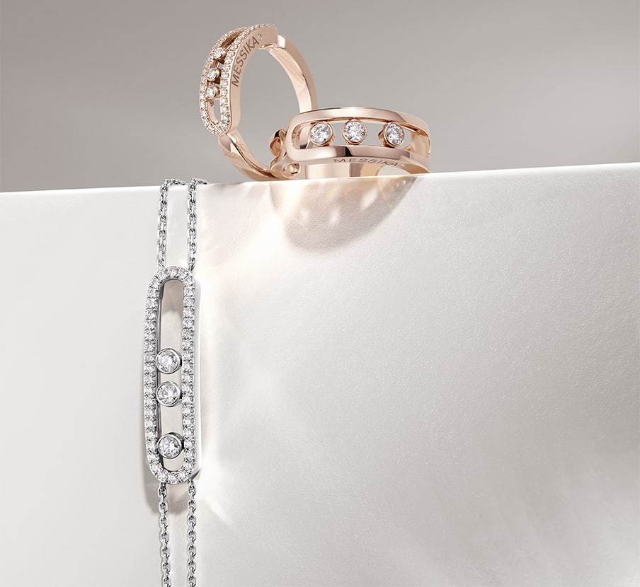 tres  pulceras una plateada, una dorada y una cobre. MESSIKA