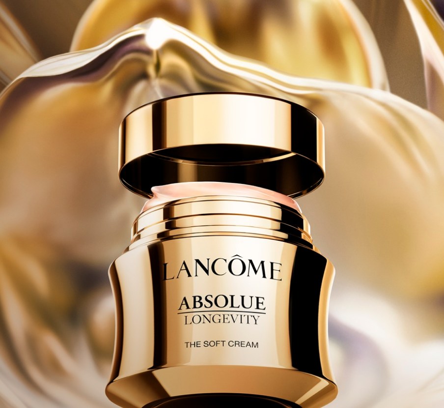 Imagen de frasco dorado de la marca LANCÔME. LANCÔME