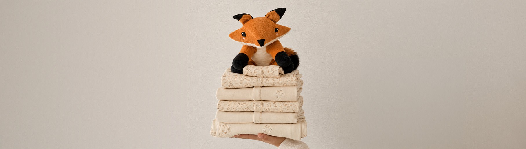 imagen de zorro de peluche y toallas de la marca PRIMMI  