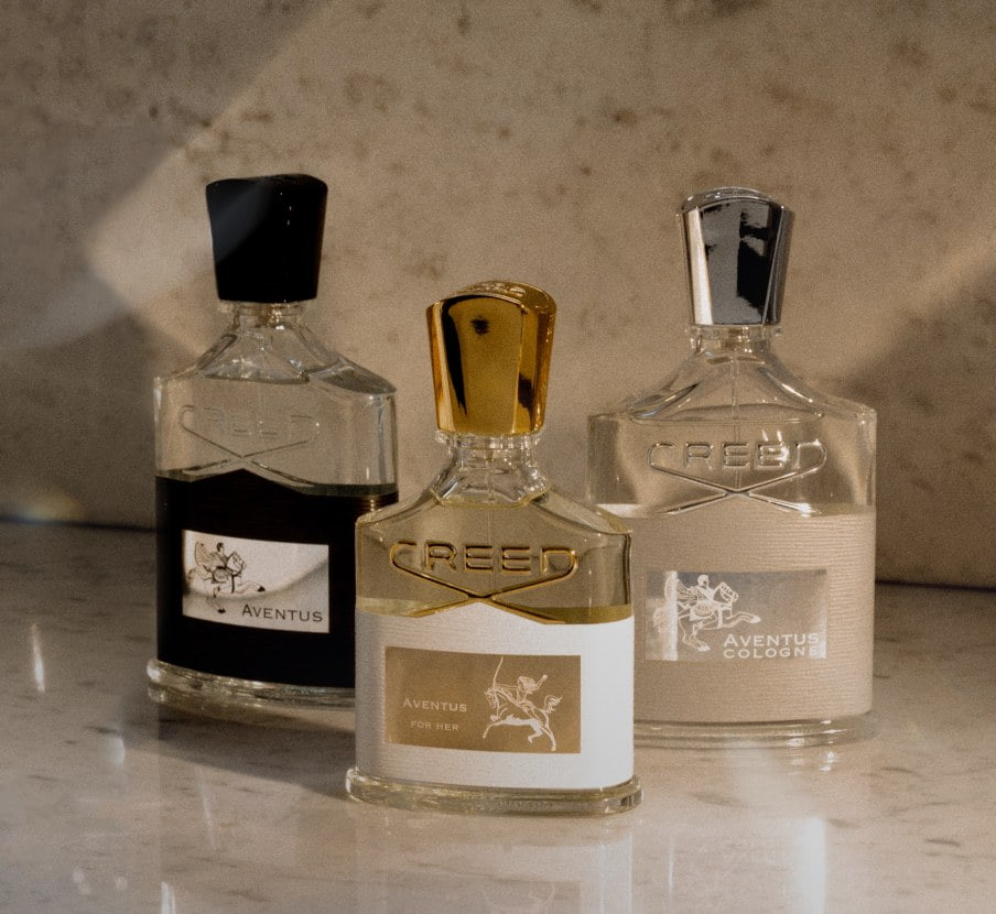 imagen de 3 botellas de lociones de la marca CREED