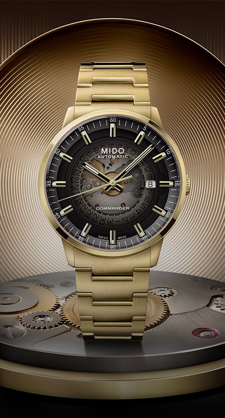 reloj dorado con caratula negra la marca MIDO