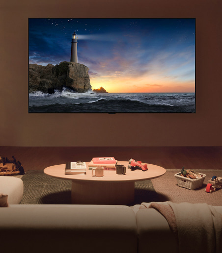 imagen de faro en un rizco con el atardecer al fondo LG