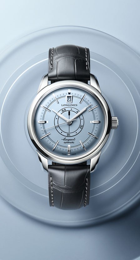imagen de reloj con caratula blanca y correa gris la marca LONGINES