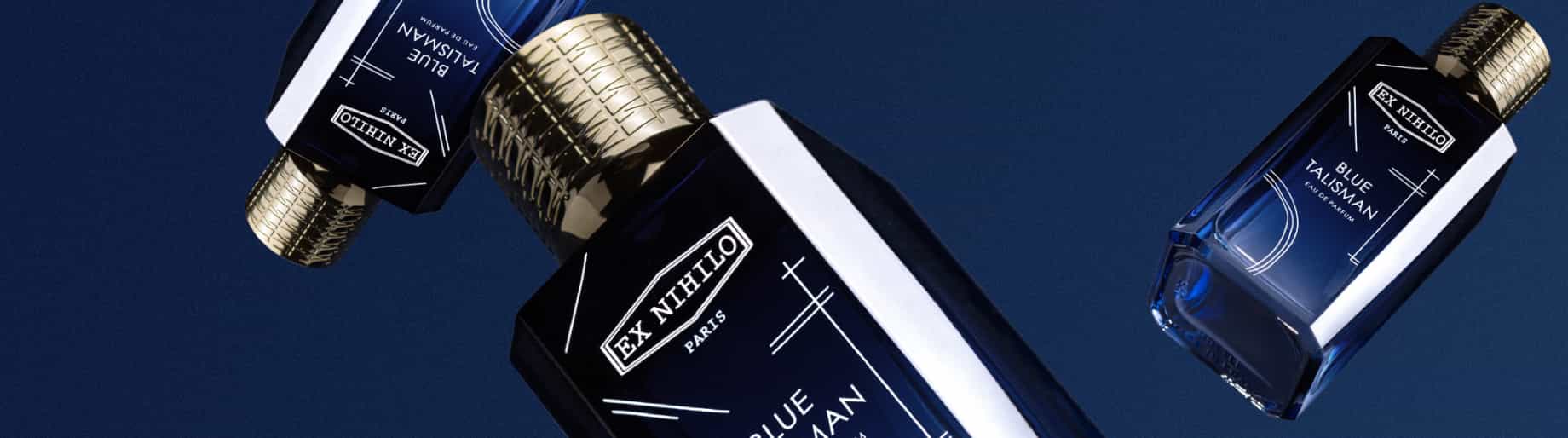 imagen 3 botellas de color azul con tapa plateada de producto EX NIHILO