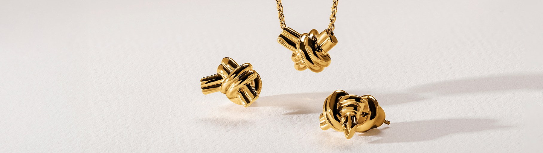 Imagen de dijes de oro de la marca TANE