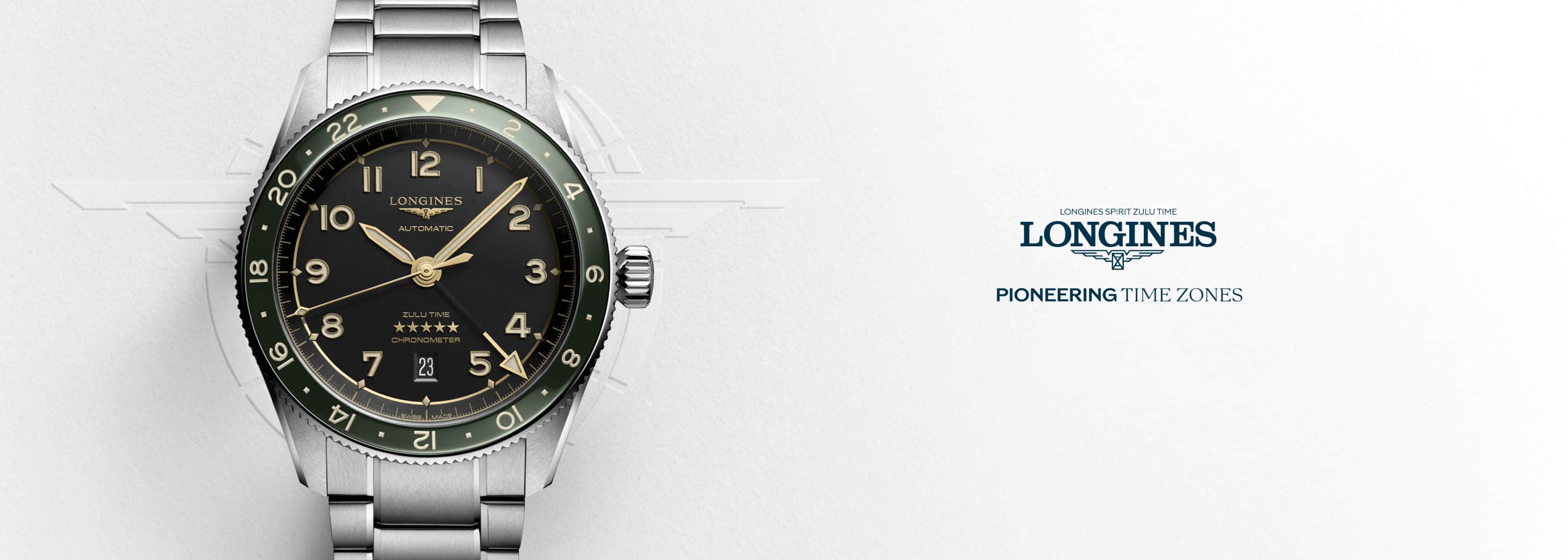 Reloj color plateado con caratula negra y contador verde, pioneering time zone. LONGINES