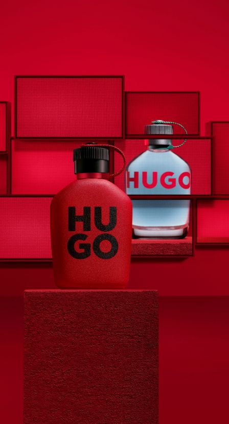 imagen de tres botellas de locion roja y otra azul, HUGO BOSS.