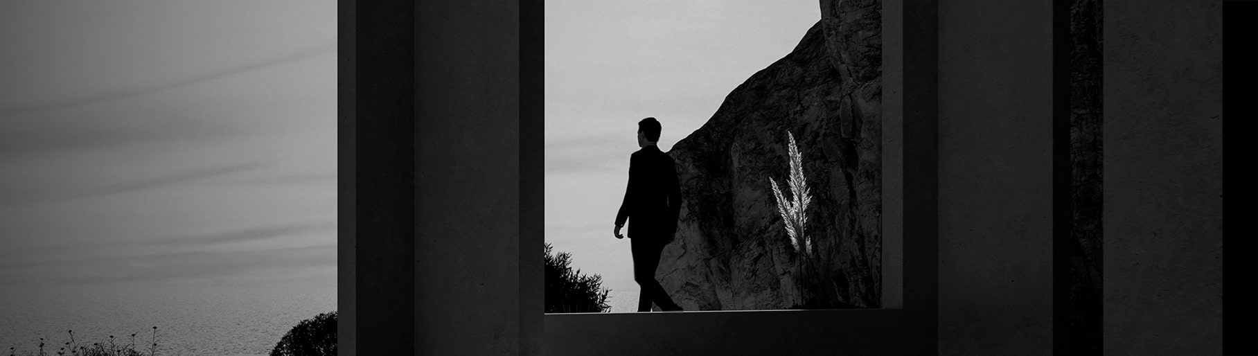 imagen de hombre con traje negro de la marca BAUME & MERCIER
