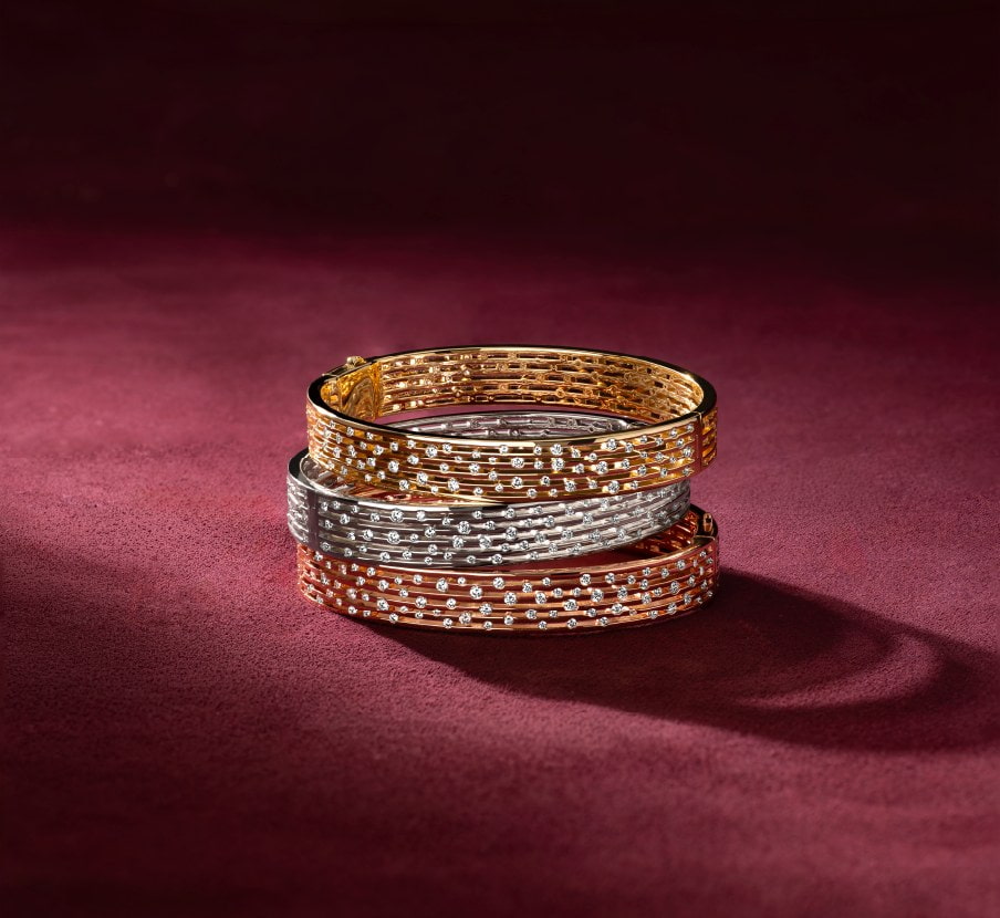 imagen de anillos uno dorado, plata y cobre de la marca APM MONACO