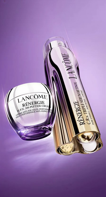 Imagen de  botella dorada con morado de la marca LANCÔME. LANCÔME